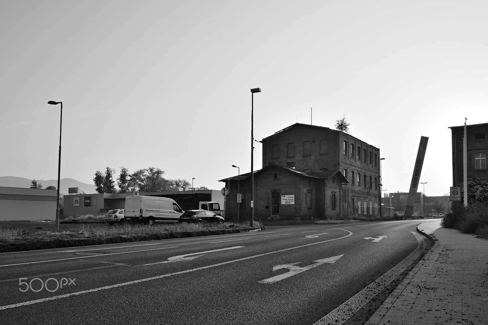 Nikon D5300 sample photo. Litomerice, czech republic - may 19, 2018: asphalt road leading around old historical industrial... photography
