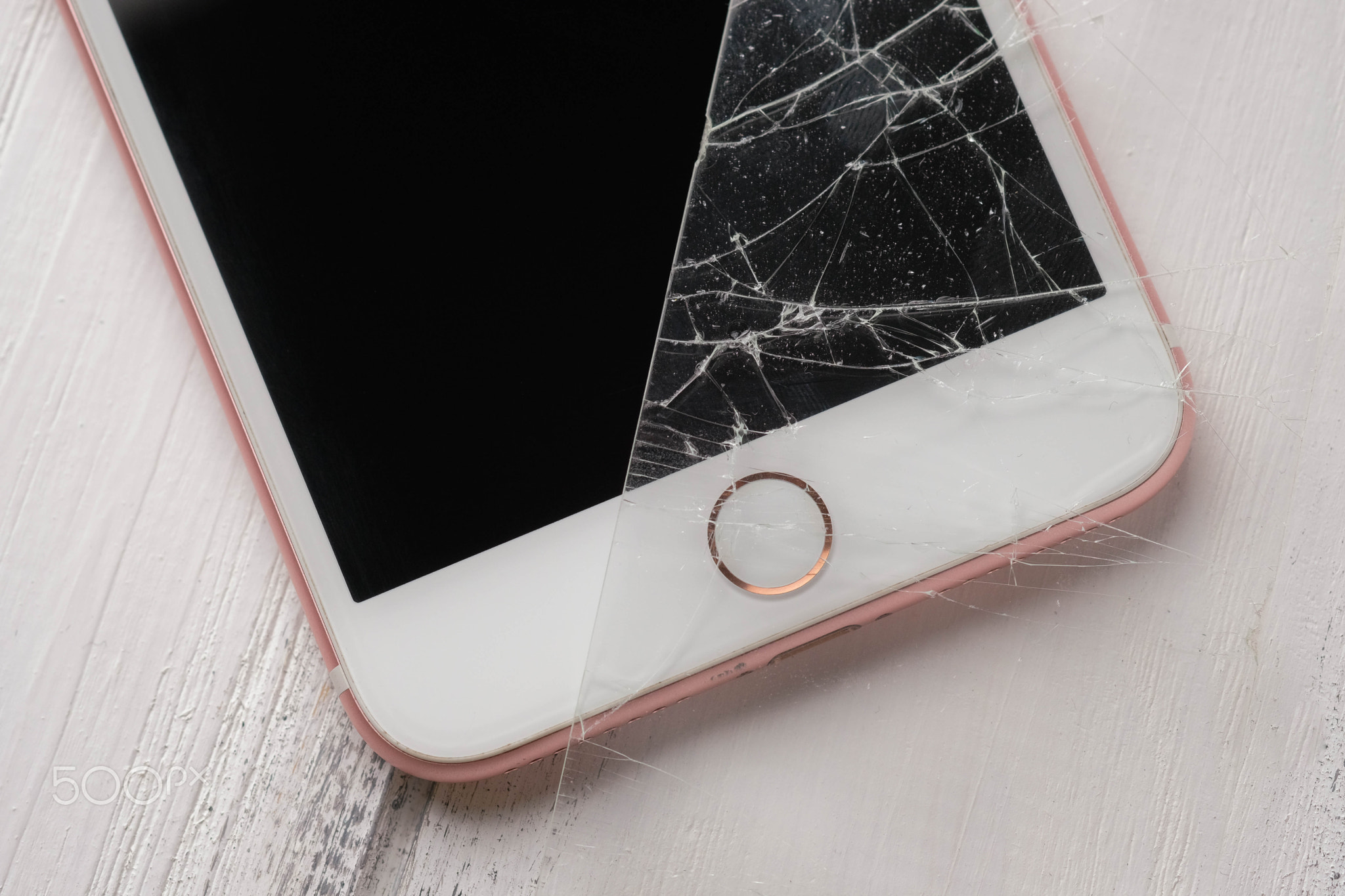 close up photo of an smart phone with broken protective glass