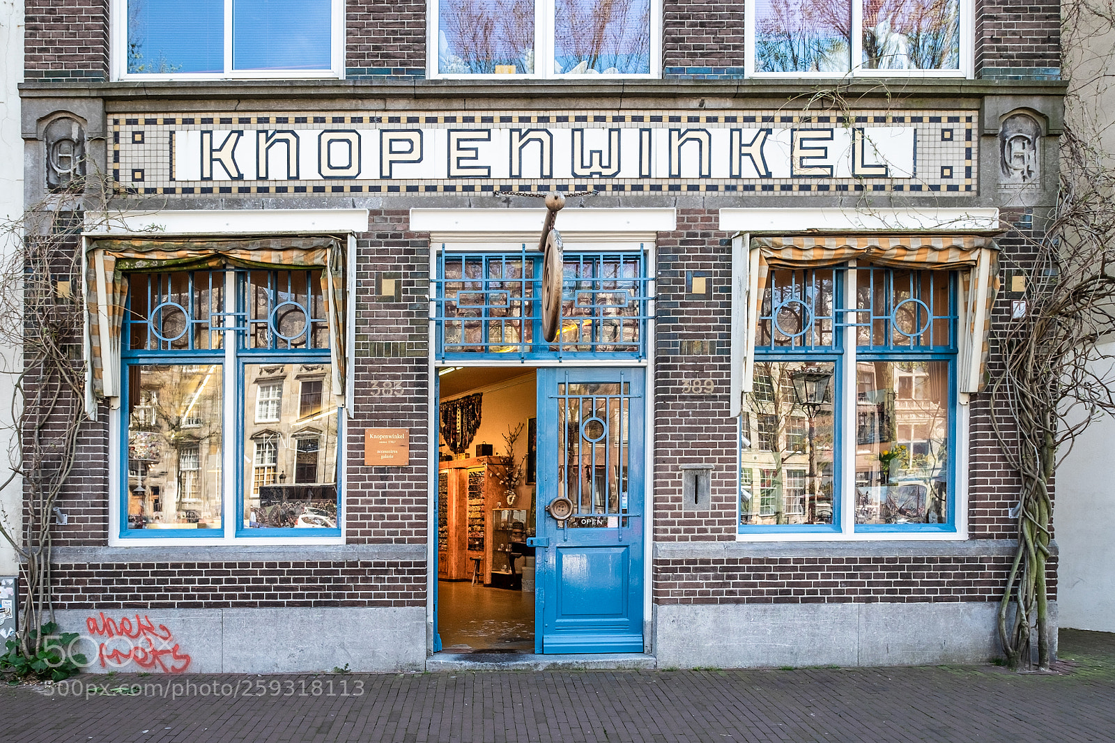 Fujifilm X-T1 sample photo. Amsterdam literally buttons store photography