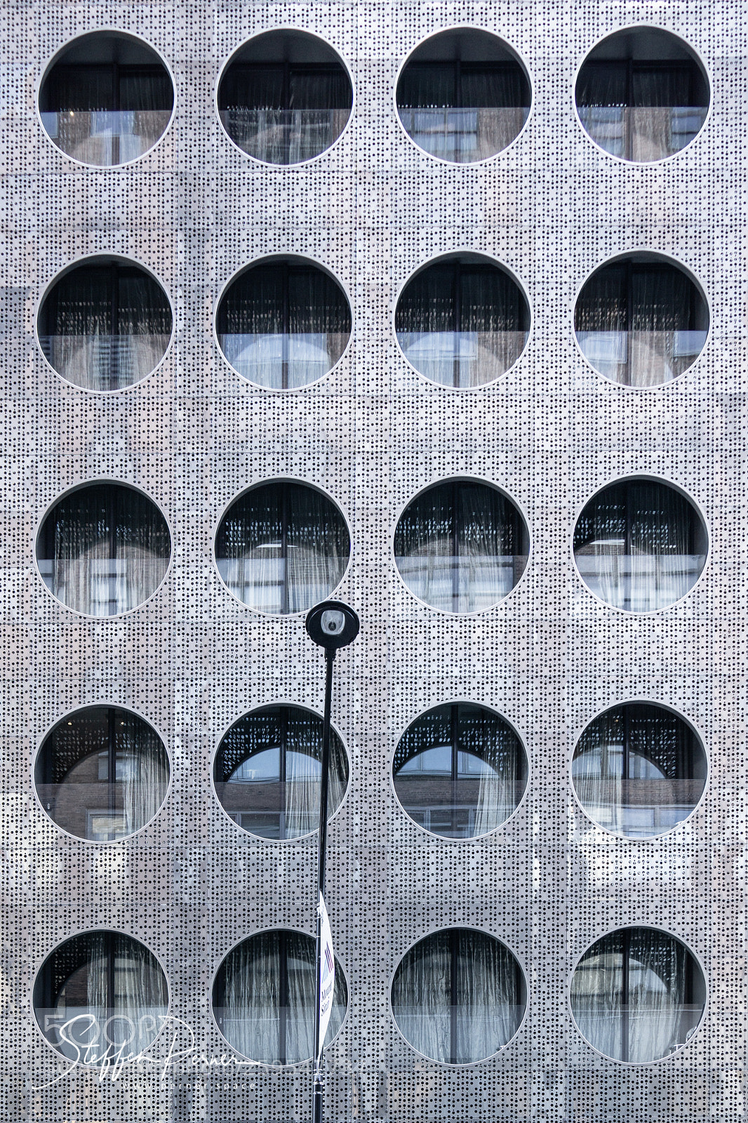 Sony a6000 sample photo. Round windows at a photography