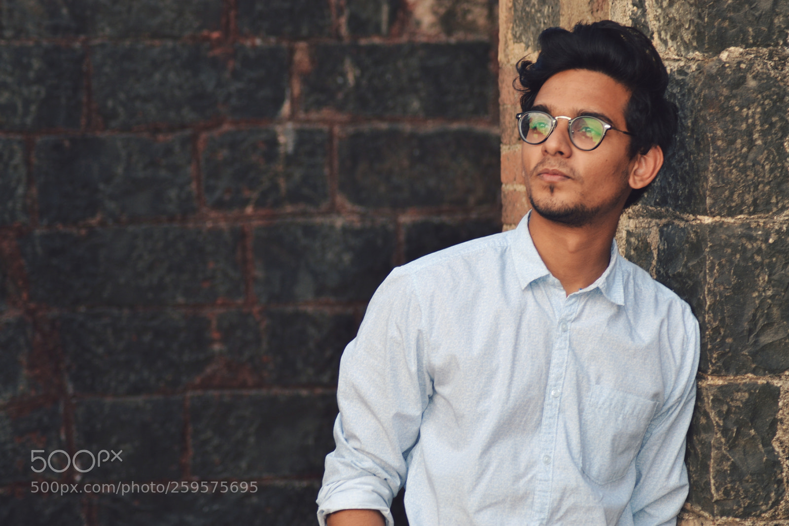 Nikon D3100 sample photo. Man leaning on black photography