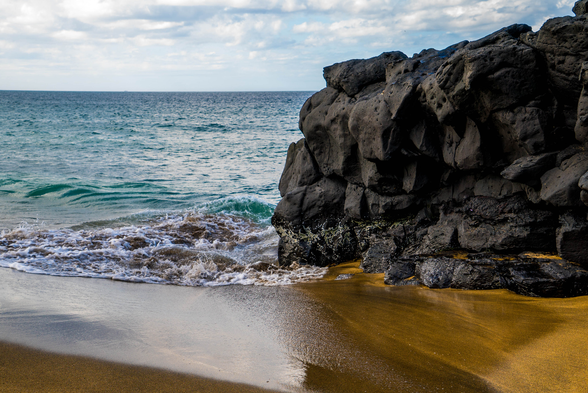 Sony a7S sample photo. Black lava, brown beach photography