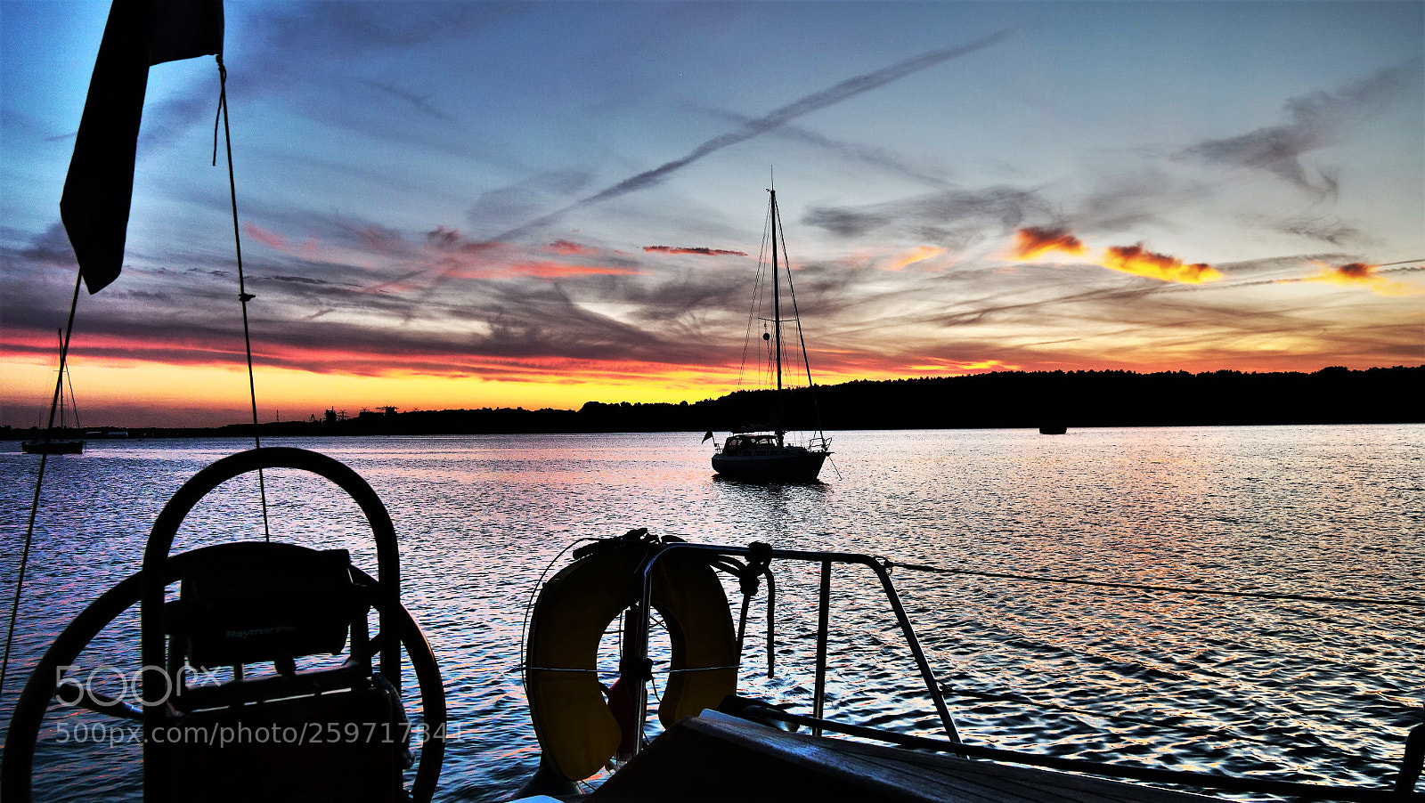 Panasonic Lumix DC-GH5 sample photo. Sunset reflecting clouds, anchoring photography