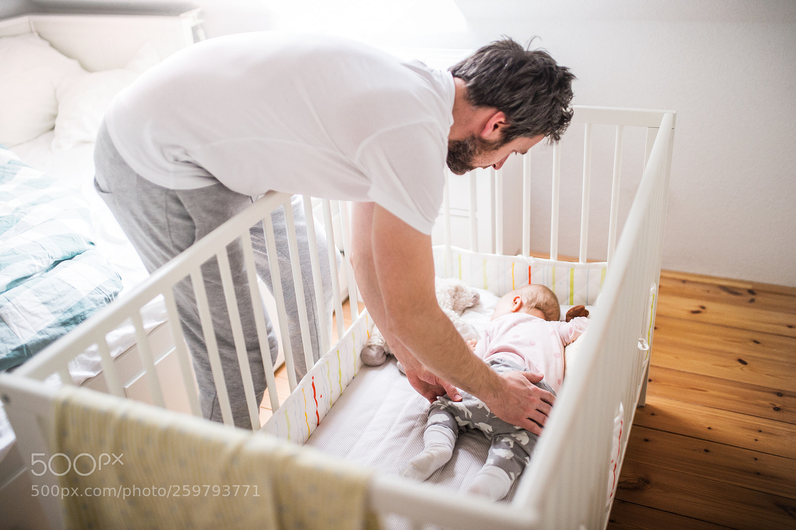 Nikon D4S sample photo. Father putting a sleeping photography