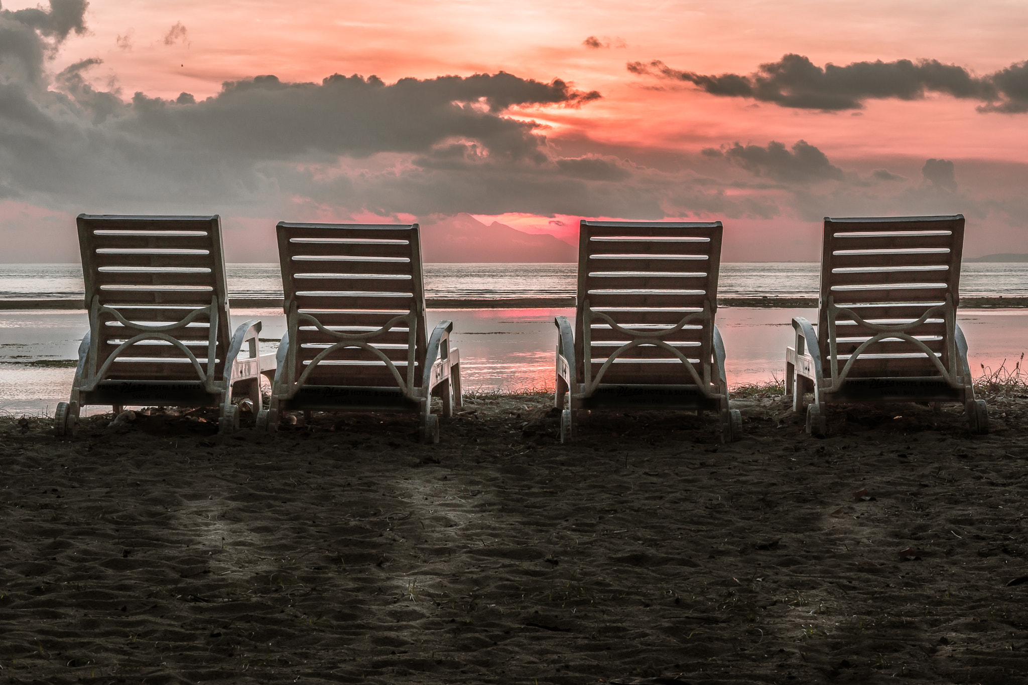 Sony Alpha NEX-7 sample photo. The backside of four chairs close to the beach in the tropical s photography