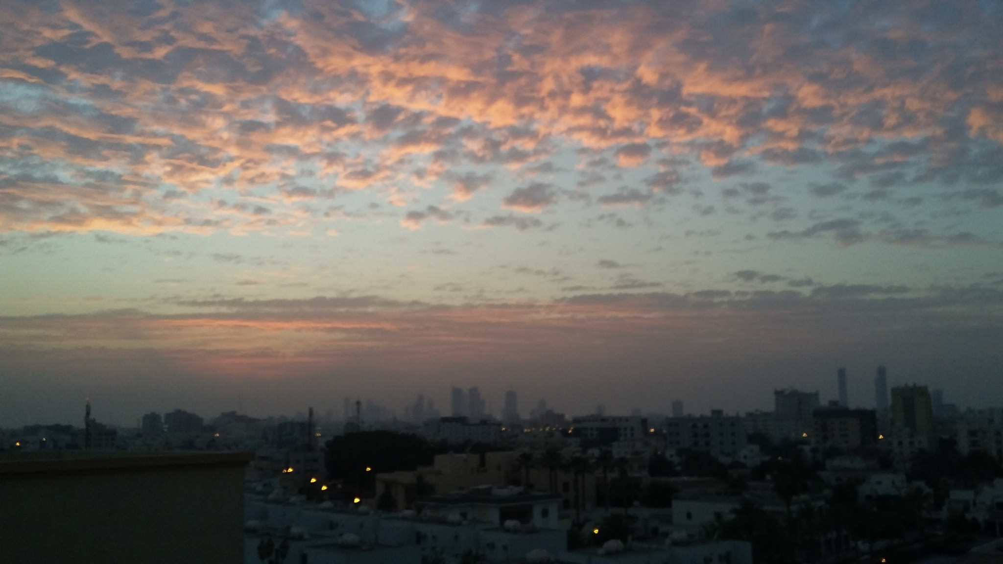 Samsung Galaxy E5 sample photo. A dicorated sunset with a panorama of city photography