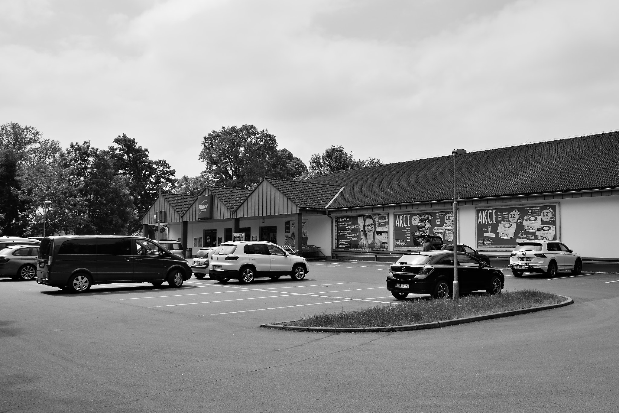 Nikon D5300 sample photo. Doksy, czech republic - may 19, 2018: many cars parked in front of legendary penny market in... photography
