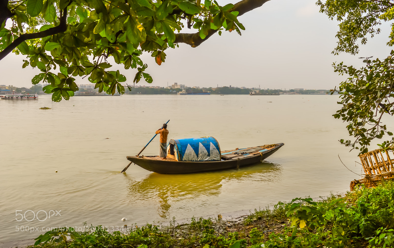 Nikon D3200 sample photo. A boatman rowing old photography