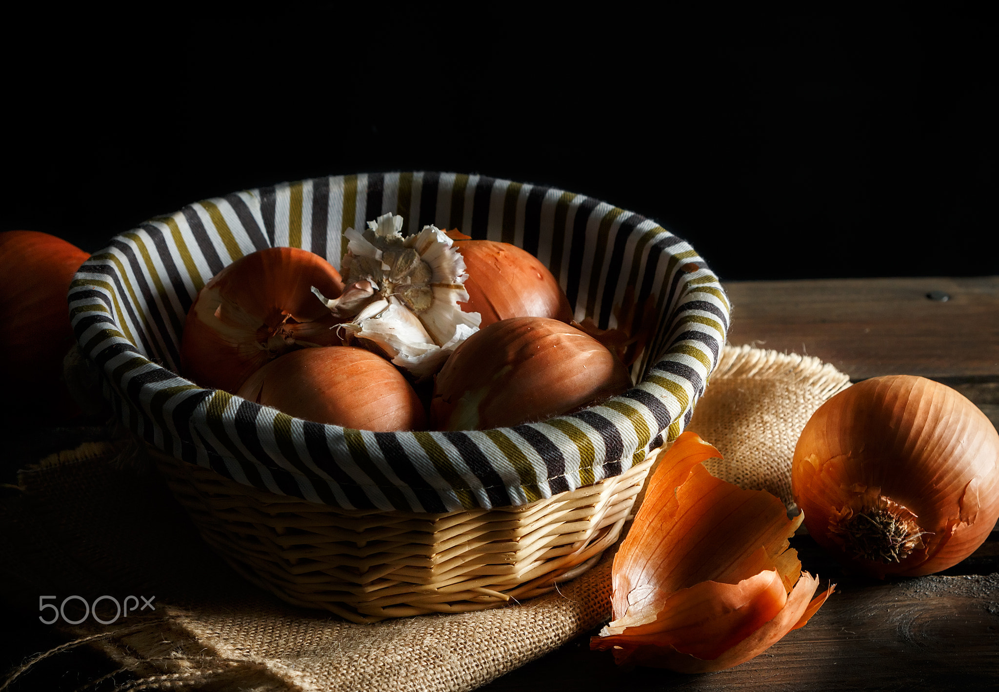 Still life of fresh onions and garlic head.