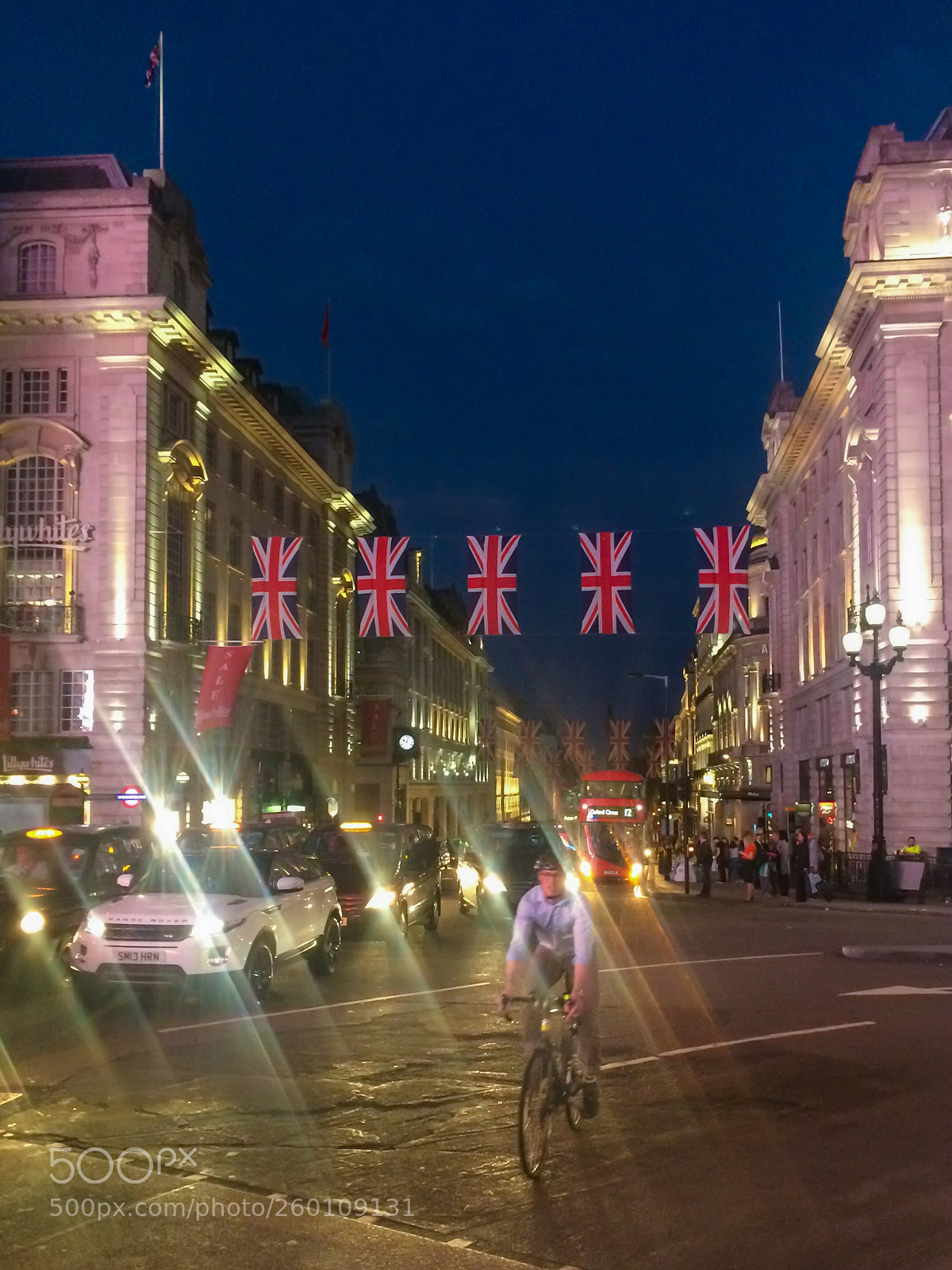 Apple iPhone 5s sample photo. Cyclist on piccadilly photography