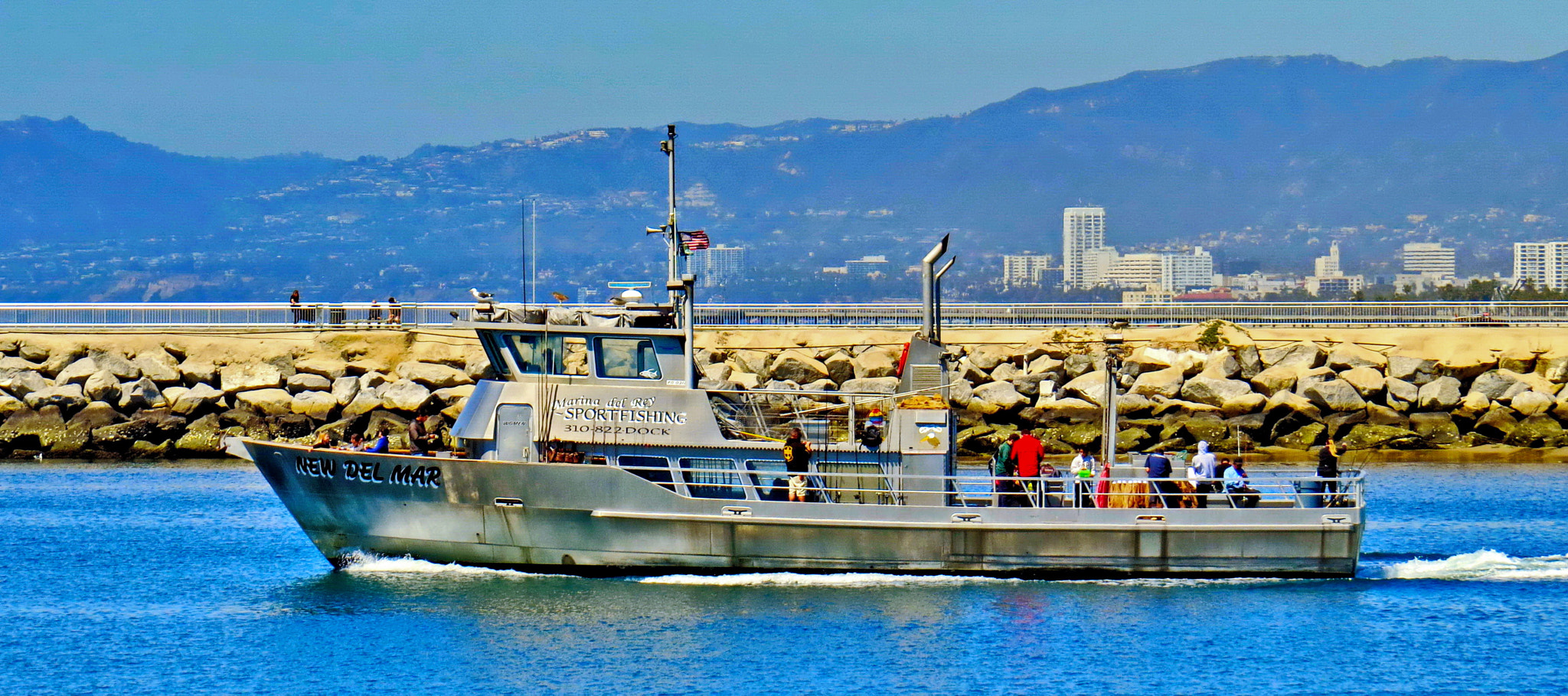Canon PowerShot SX50 HS sample photo. A fishing boat going out to the ocean photography