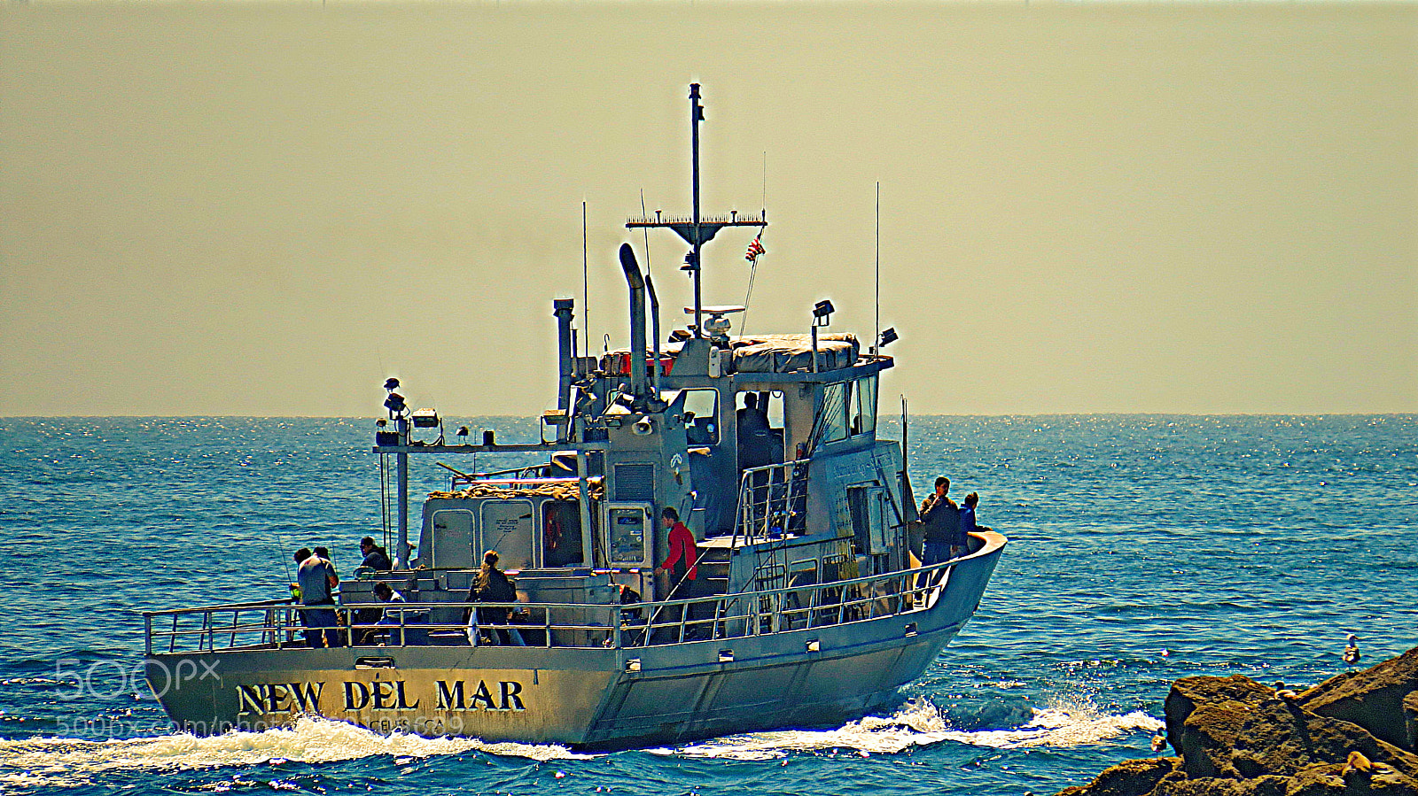 Canon PowerShot SX50 HS sample photo. Fishing boat sailing into photography