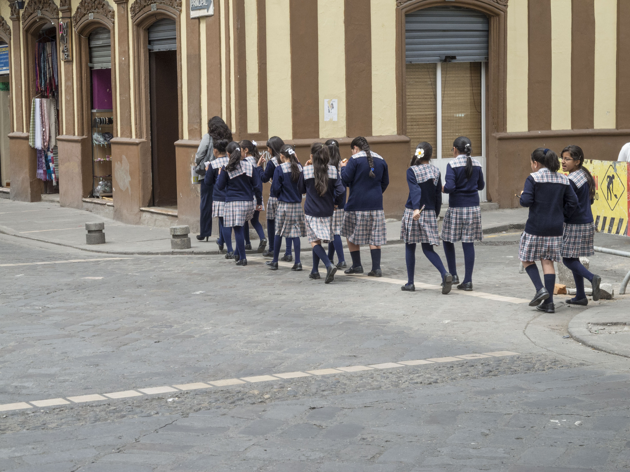 Nikon Coolpix P7100 sample photo. Ecuadorian school children crossing the street in cuenca photography
