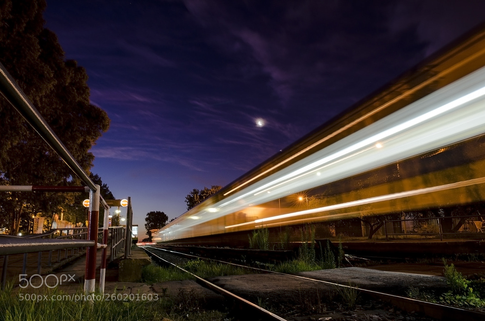Nikon D5100 sample photo. Train moving at sunset photography