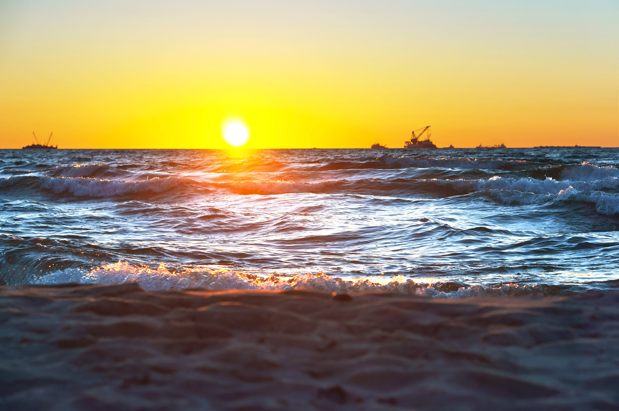 Sony Alpha NEX-3N sample photo. Red yellow sunset on the sea shore in the surf of the waves of the baltic sea and a magnificent... photography