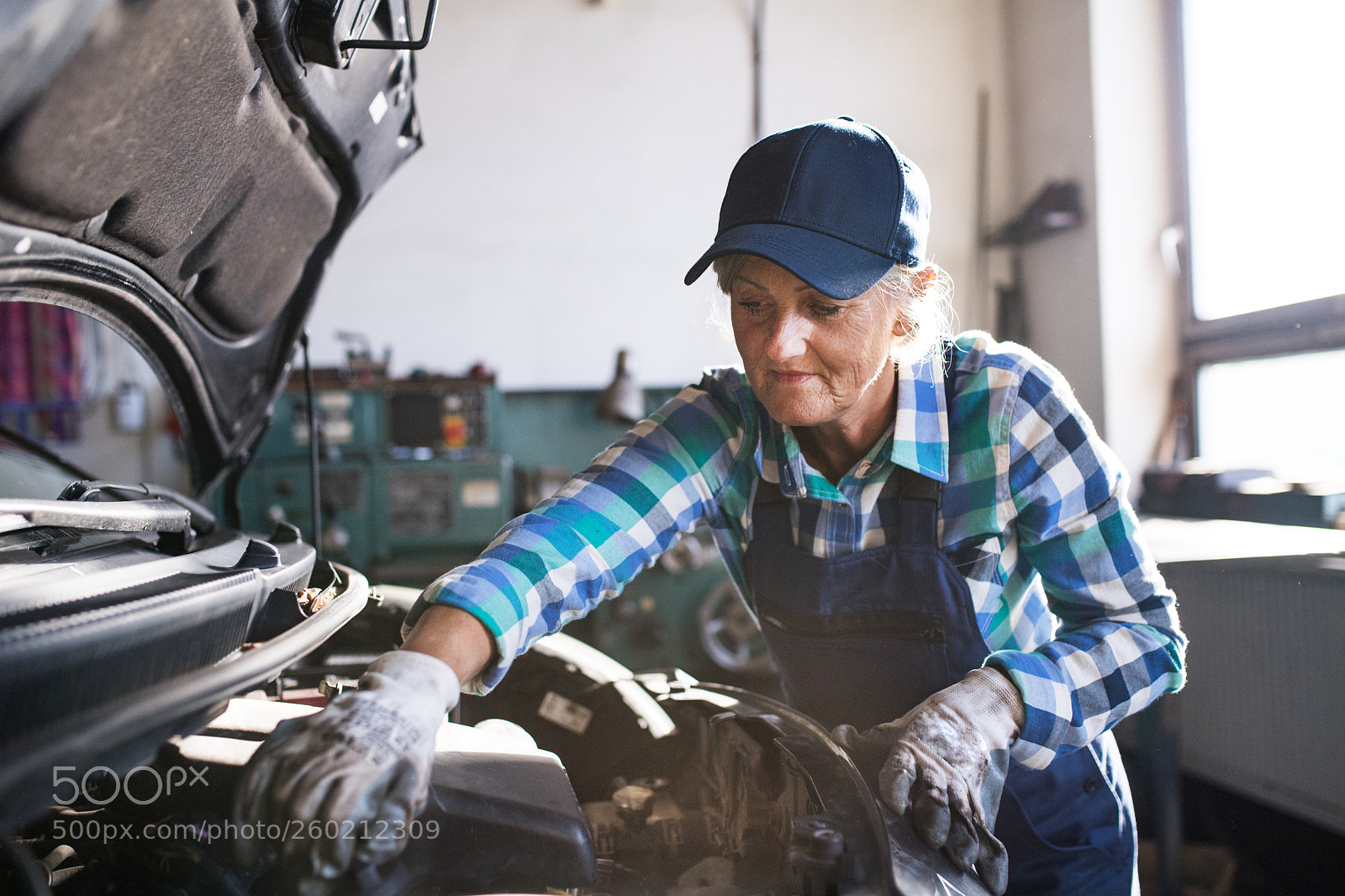 Nikon D5 sample photo. Senior female mechanic repairing photography