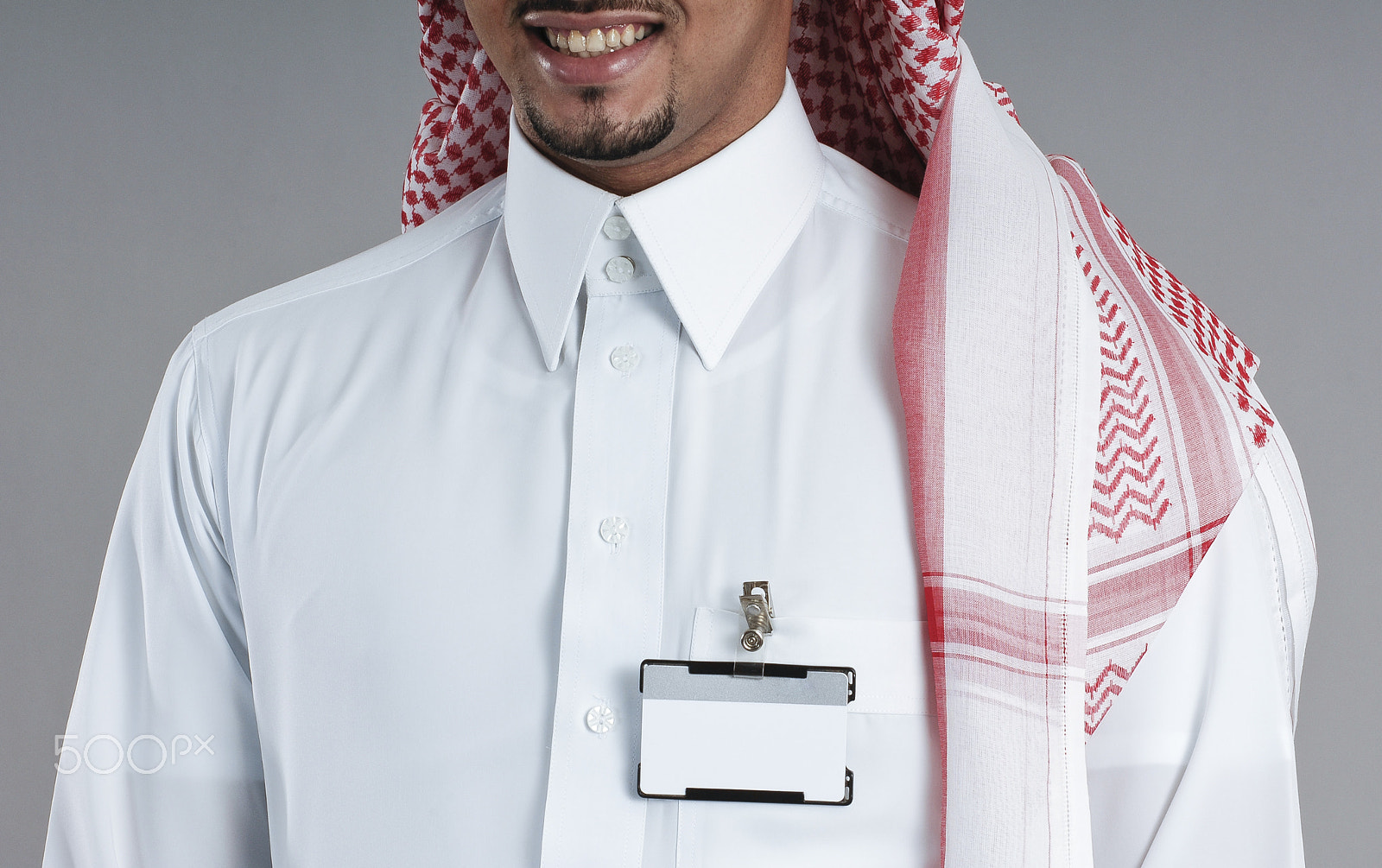 Nikon D2X sample photo. Saudi man torso with an isolated badge on his chest photography
