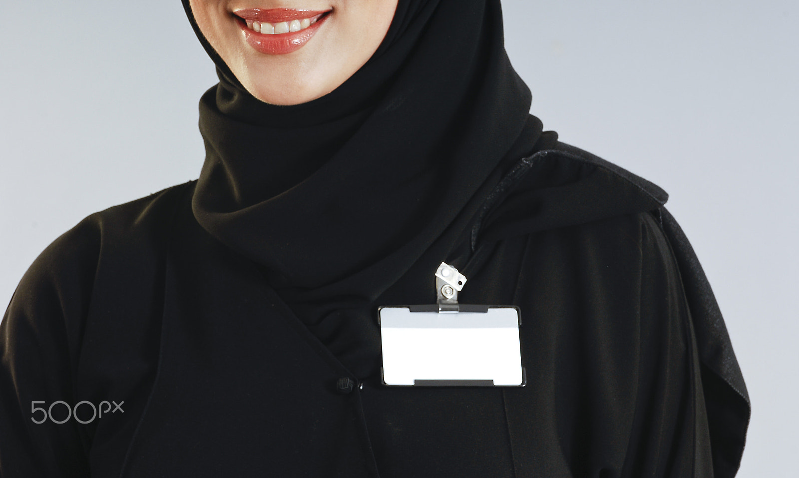 Nikon D2X sample photo. Saudi woman torso with an isolated badge on her chest photography