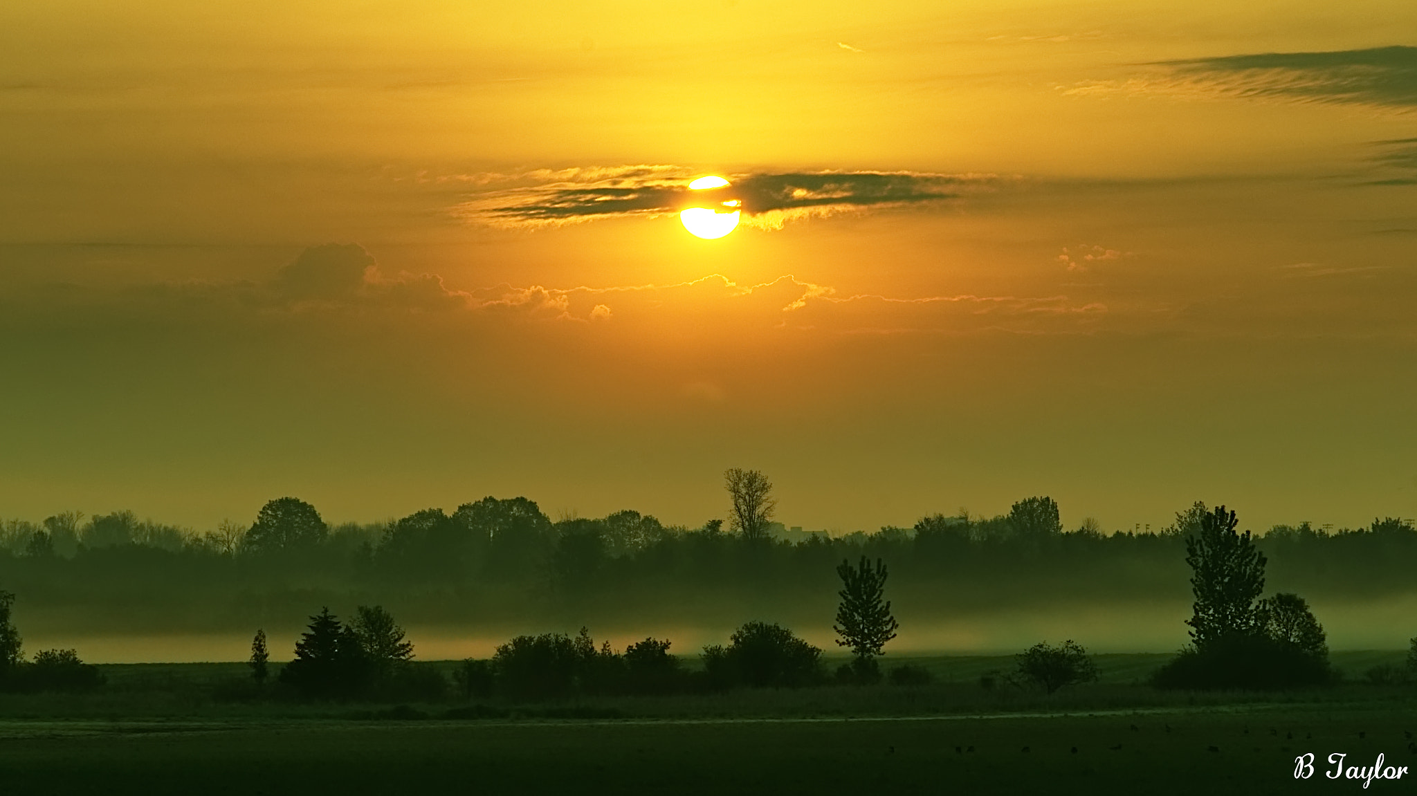 Sony SLT-A57 sample photo. Hazy sunrise in clouds photography