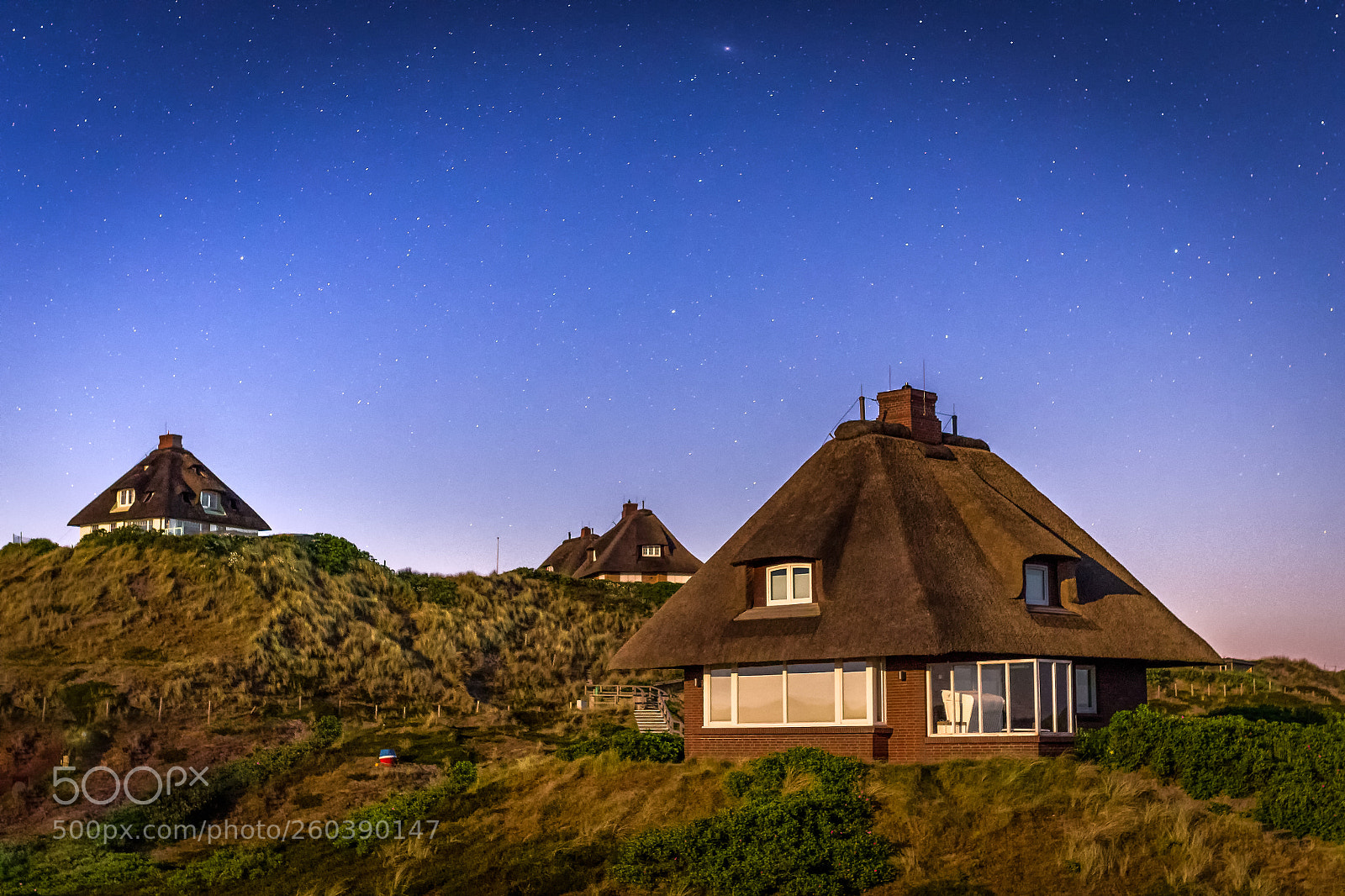 Pentax K-1 sample photo. Thatched house, glowing lights photography