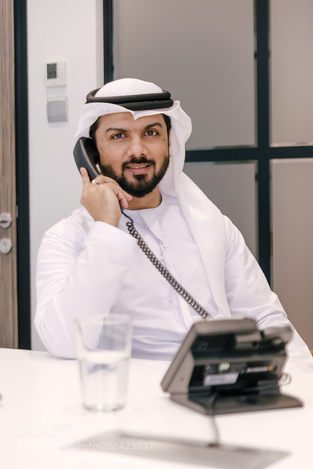 Nikon D610 sample photo. Arabian businessman talking at photography