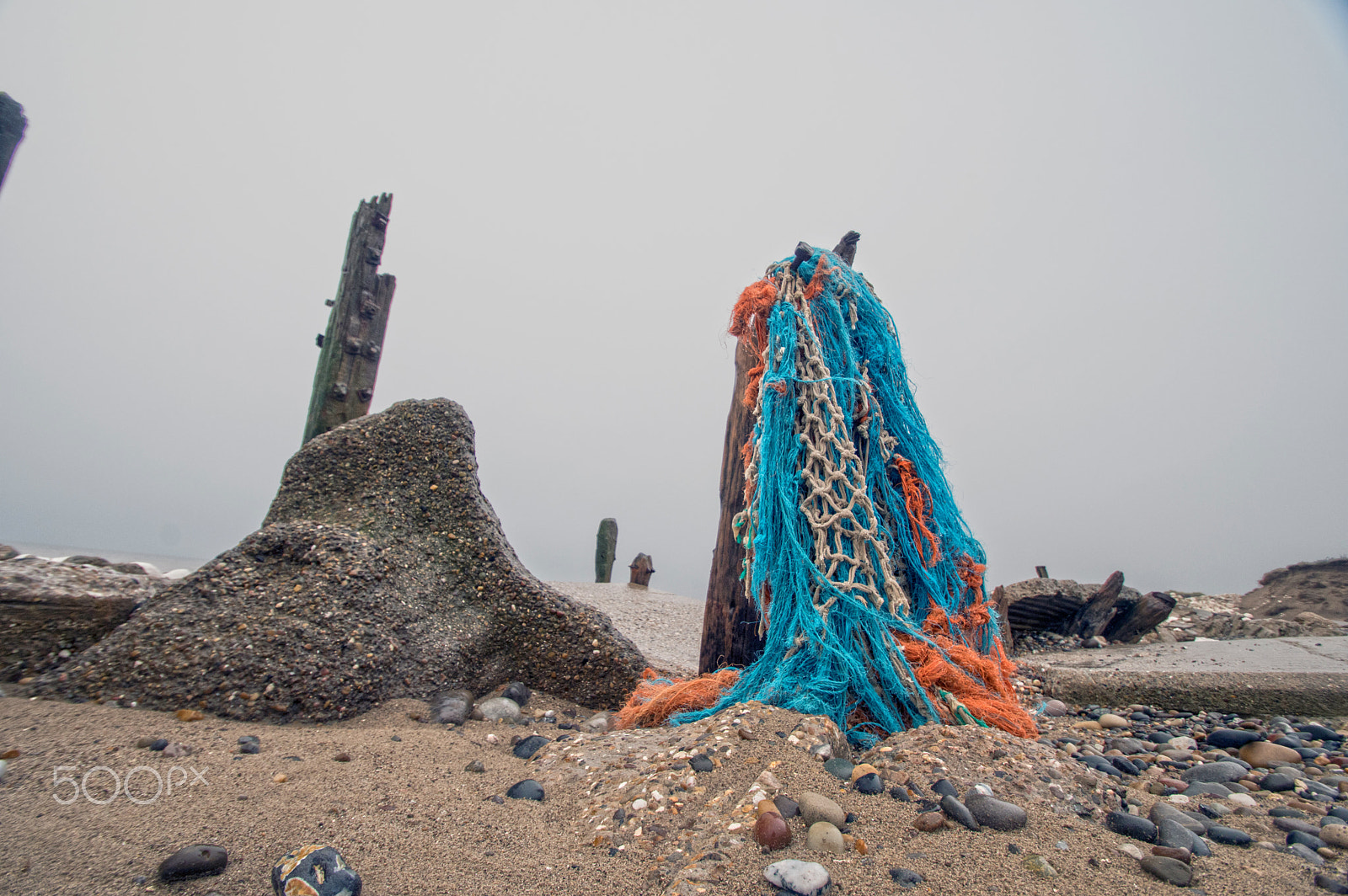 Pentax KP sample photo. Fishing nets on beach photography