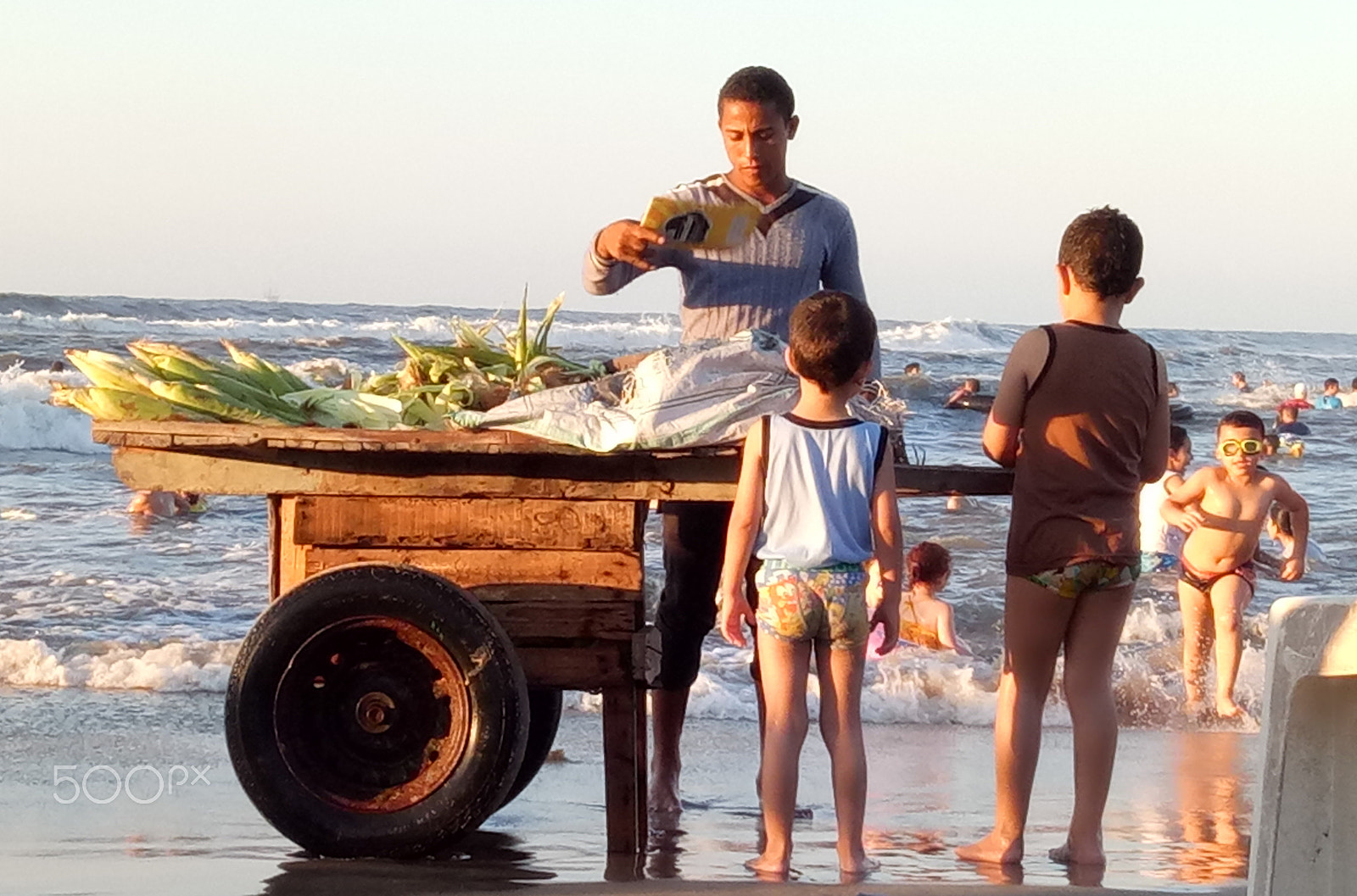 OPPO X9009 sample photo. Kids buy corn from a street vendor photography