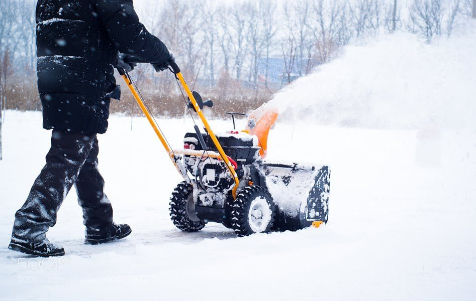 Sony Alpha DSLR-A200 sample photo. A man cleans snow photography