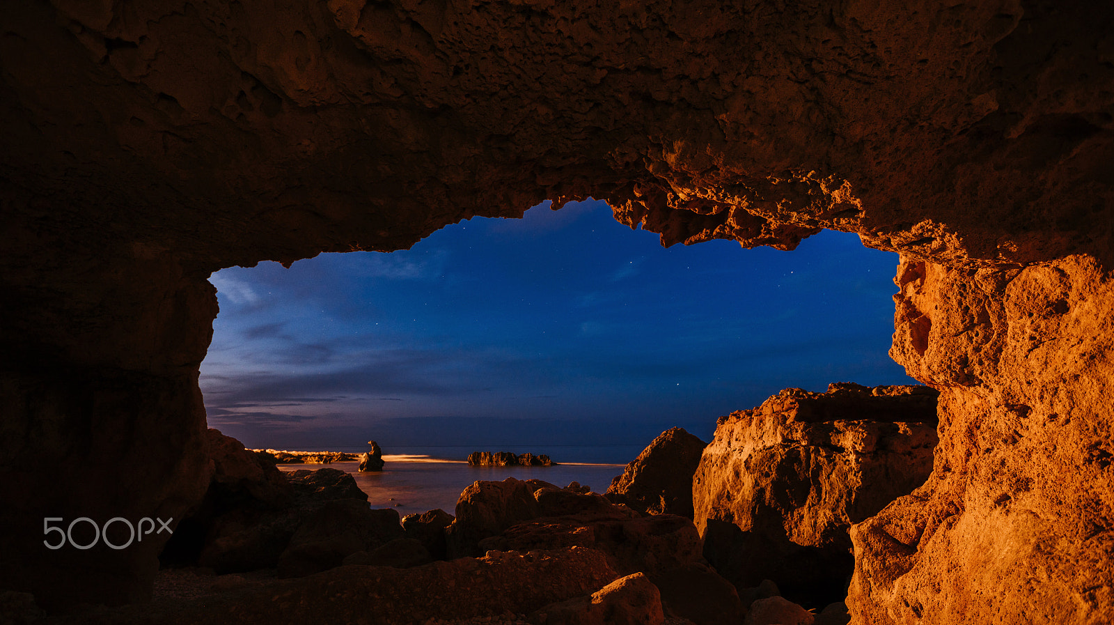 Sony a99 II sample photo. Sunset on the beach among the rocks near the city of denia. district of valencia, spain. photography