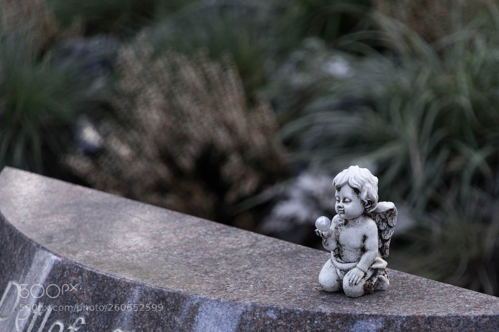 Sony a7 II sample photo. Figure holds a pearl photography