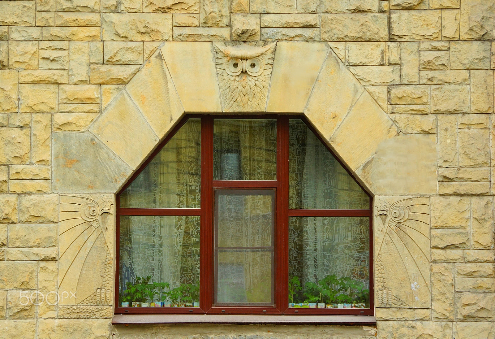 Tamron AF 28-105mm F4-5.6 [IF] sample photo. Fragment of the facade of a house with a window and an owl in the art nouveau style photography