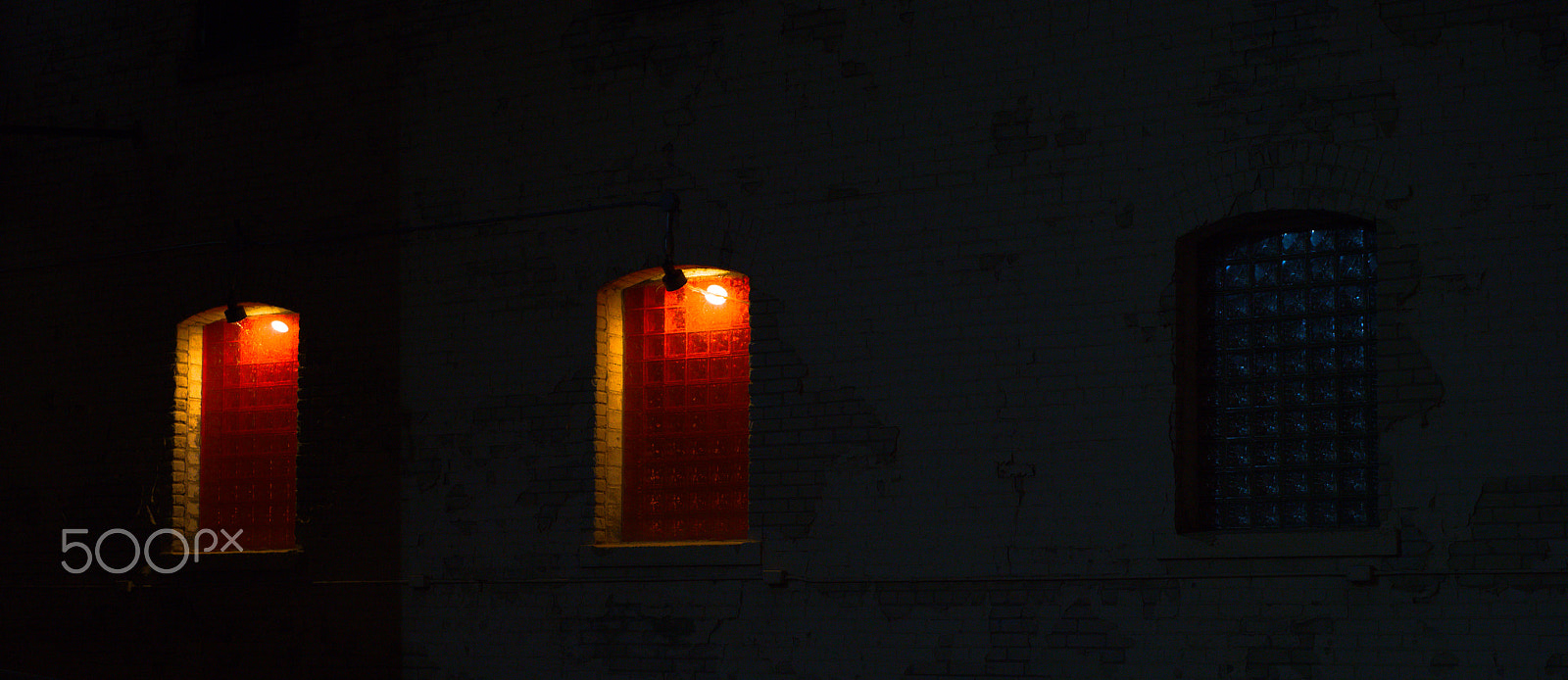 Sony a7R III + Sony Sonnar T* FE 55mm F1.8 ZA sample photo. Three dimly lit windows at night photography