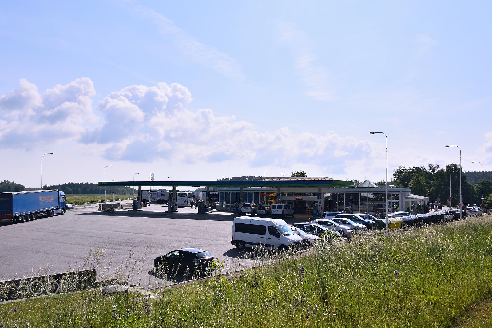 Nikon D5300 sample photo. Mikulasov, czech republic - june 02, 2018: filling station named omv with parked cars and camions... photography
