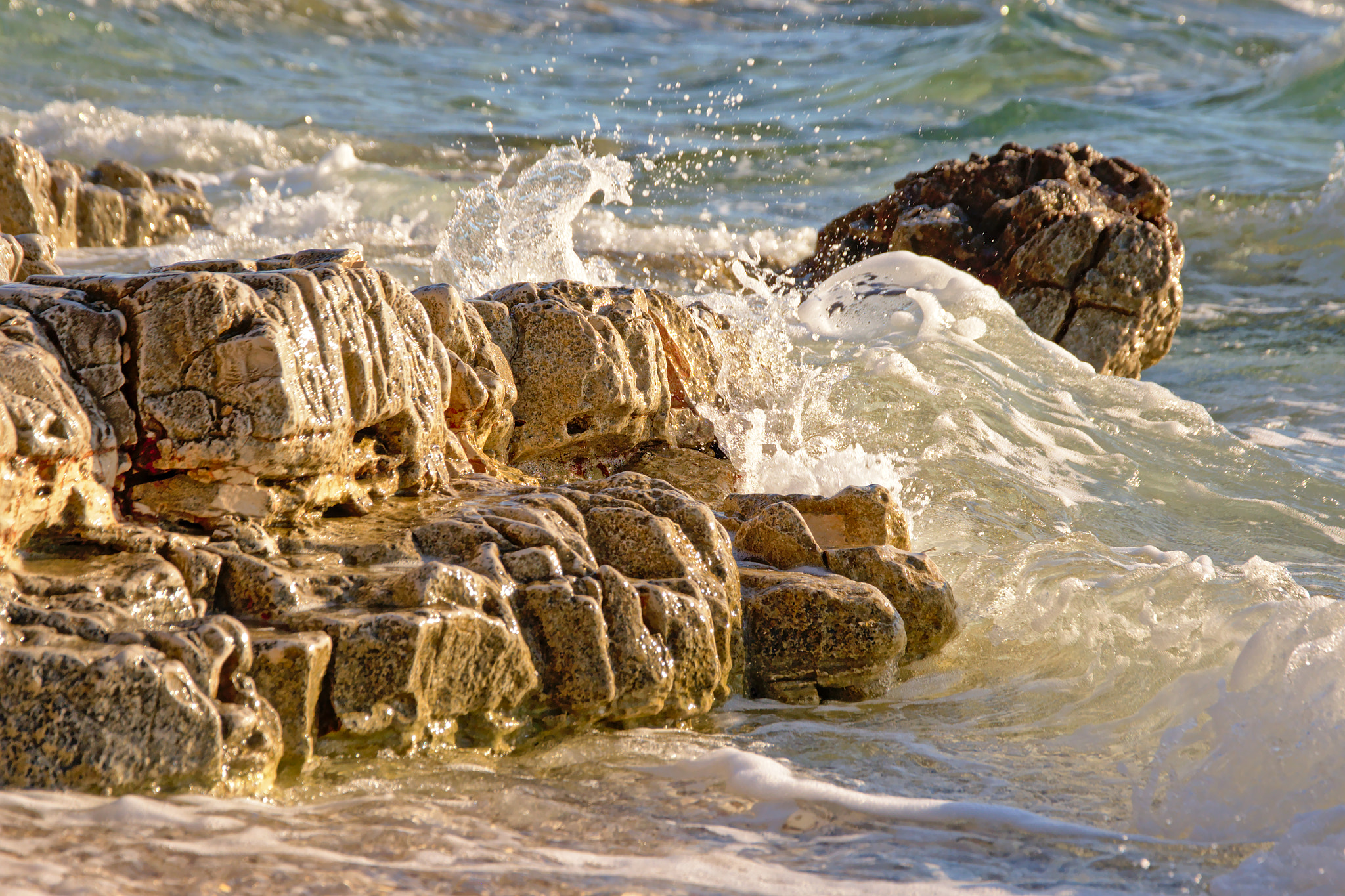 Nikon D5200 sample photo. Waves splashing into volcanic rocks on the coast o photography