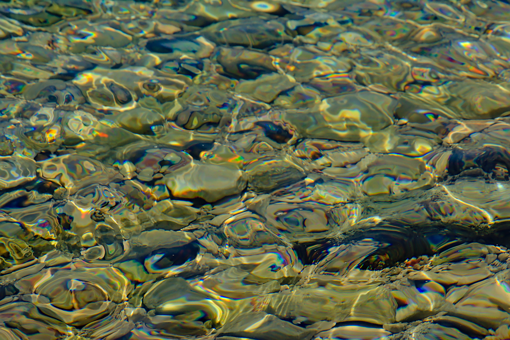Nikon D5200 sample photo. Clear water with sun ripples and stones photography