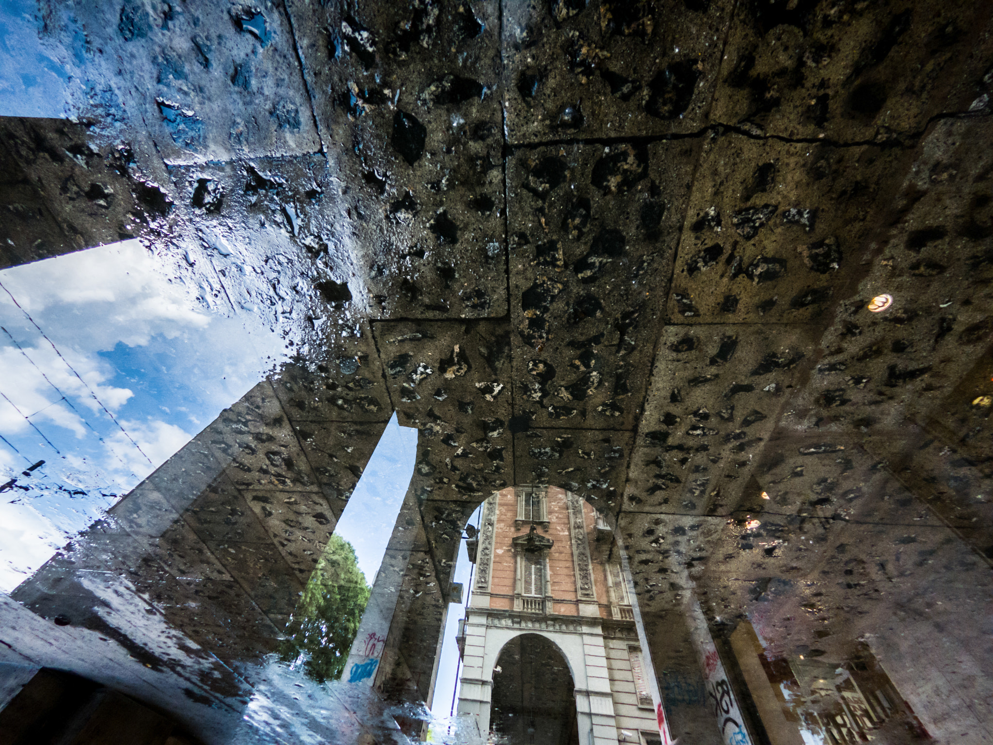 GoPro Hero6 Black sample photo. City streets reflected in the puddle photography