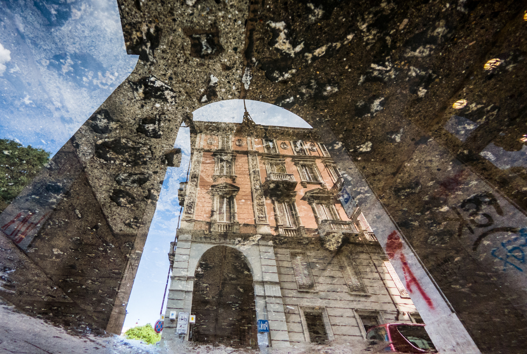 GoPro Hero6 Black sample photo. City streets reflected in the puddle photography