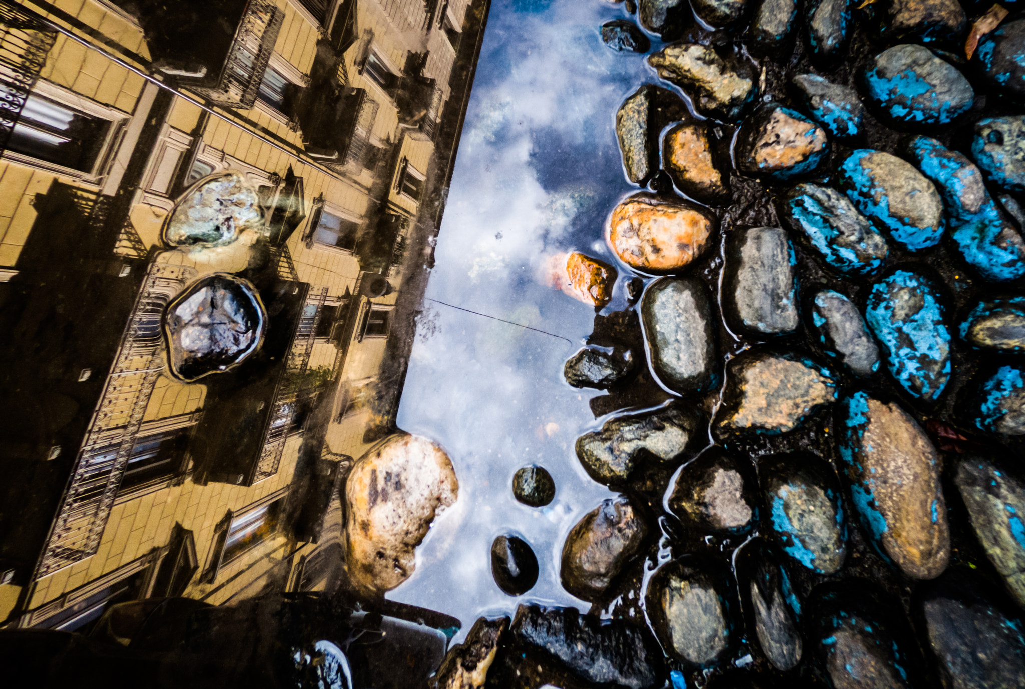 GoPro Hero6 Black sample photo. City streets reflected in the puddle photography