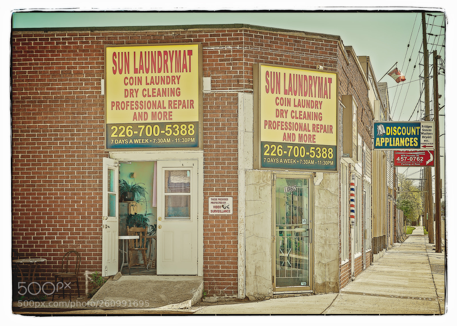Sony a7R sample photo. Sun laundrymat photography