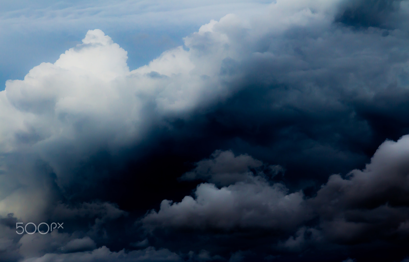 Canon EOS M sample photo. Overcast sky with dark storm clouds photography