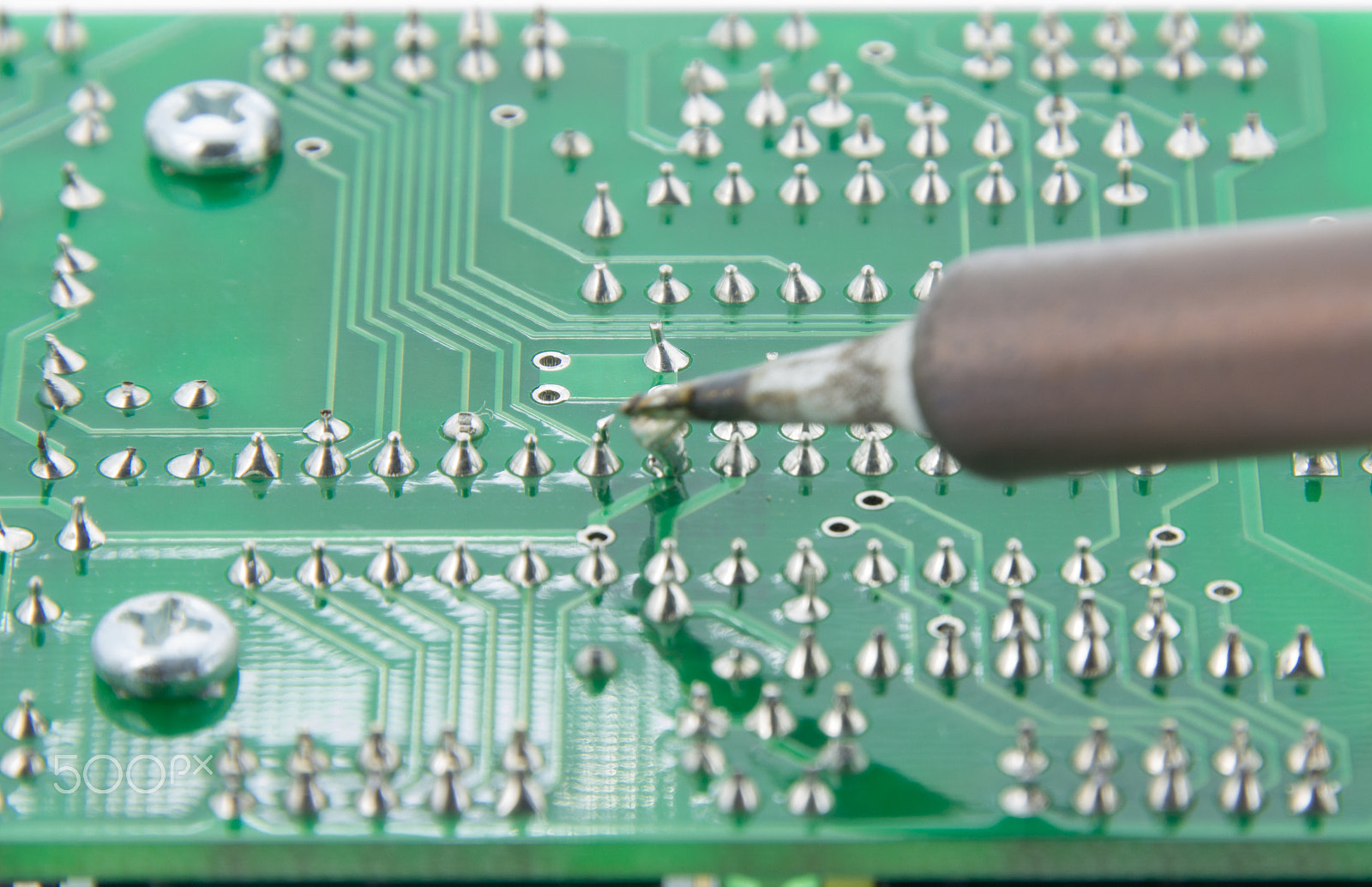 Canon EOS M sample photo. The solder electronics pcb with the soldering iron photography