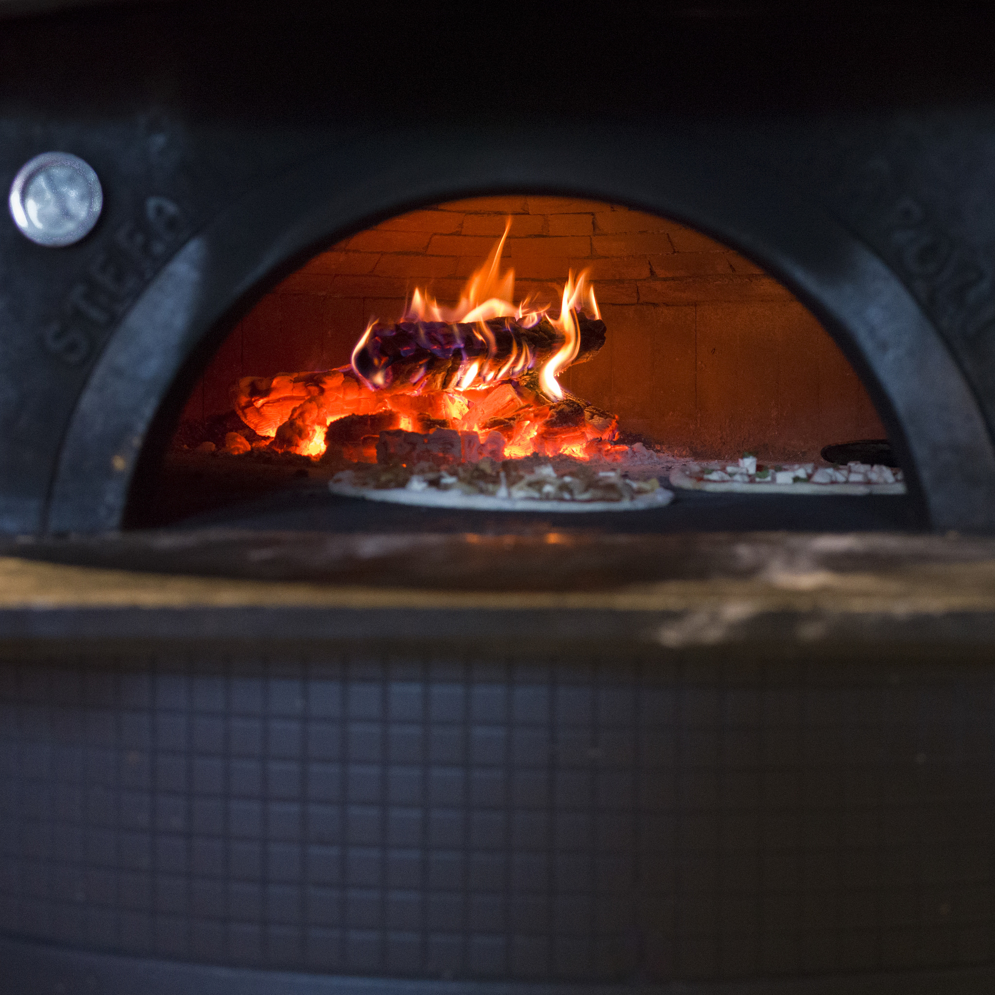 Hasselblad X1D-50c sample photo. Pizza being baked in traditional oven, stonefire pizzeria, kimbe photography