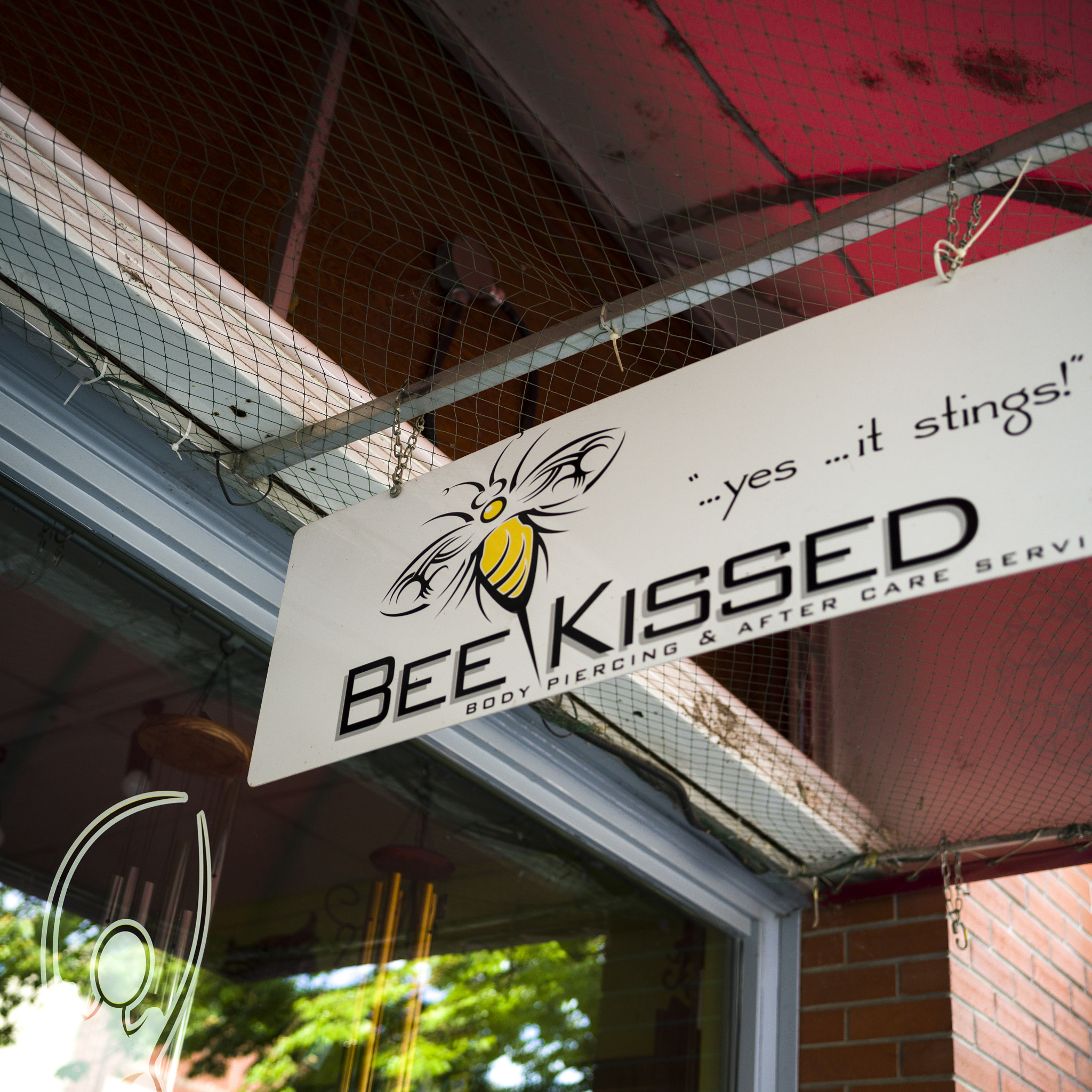 Hasselblad X1D-50c sample photo. Low angle view of signboard of body piercing parlor, nelson, bri photography