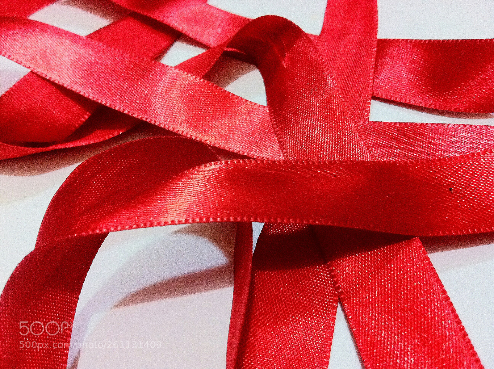 Apple iPhone 4 sample photo. Red ribbon unraveled photography
