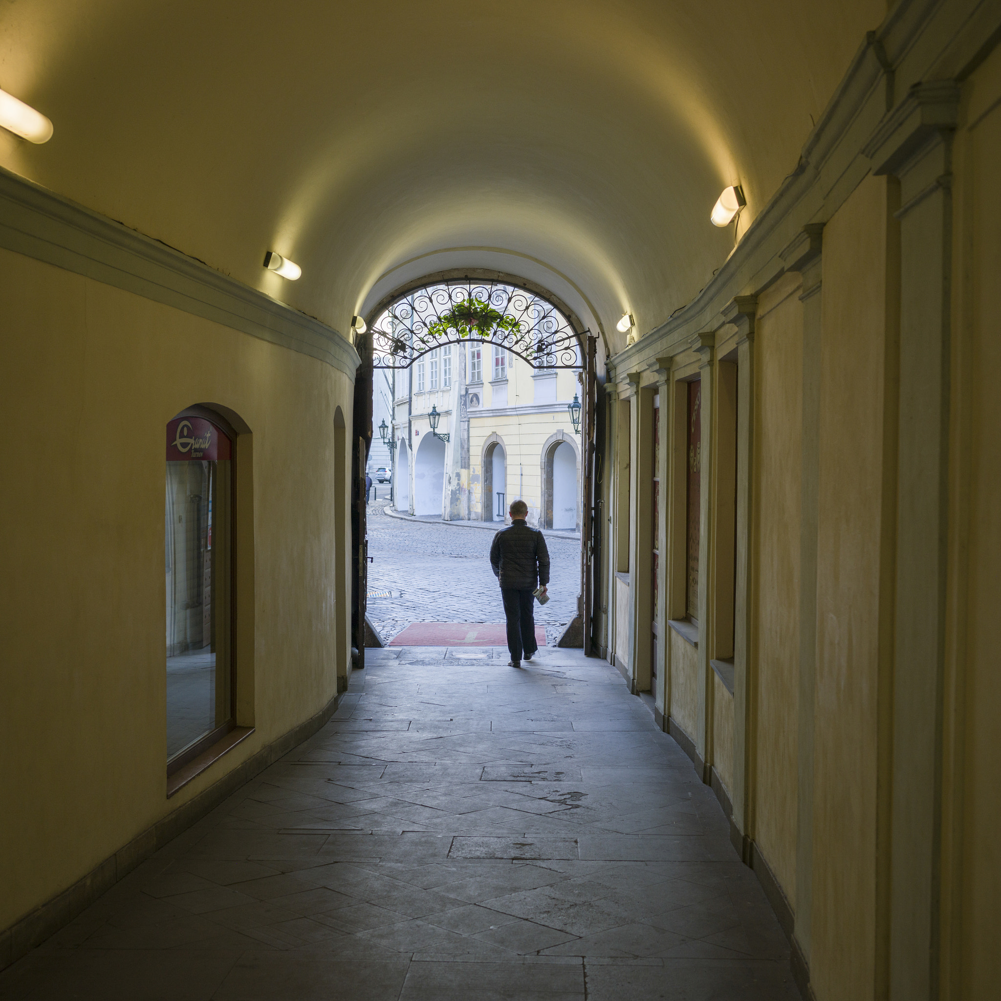 Hasselblad X1D-50c sample photo. Rear view of man walking out of the house gate, prague, czech re photography