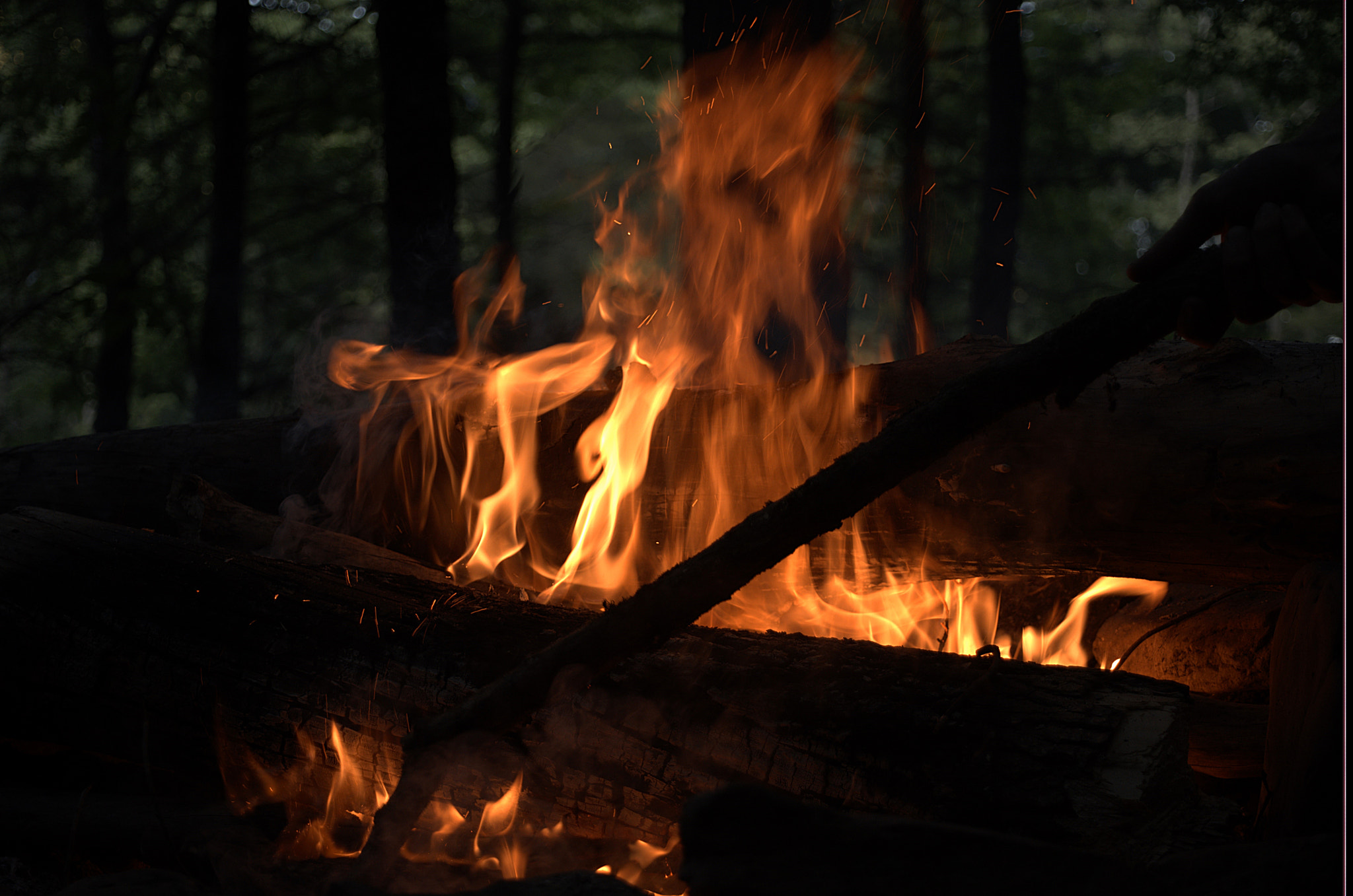 Nikon D610 + AF Zoom-Nikkor 28-80mm f/3.5-5.6D sample photo. Stoking the fire photography