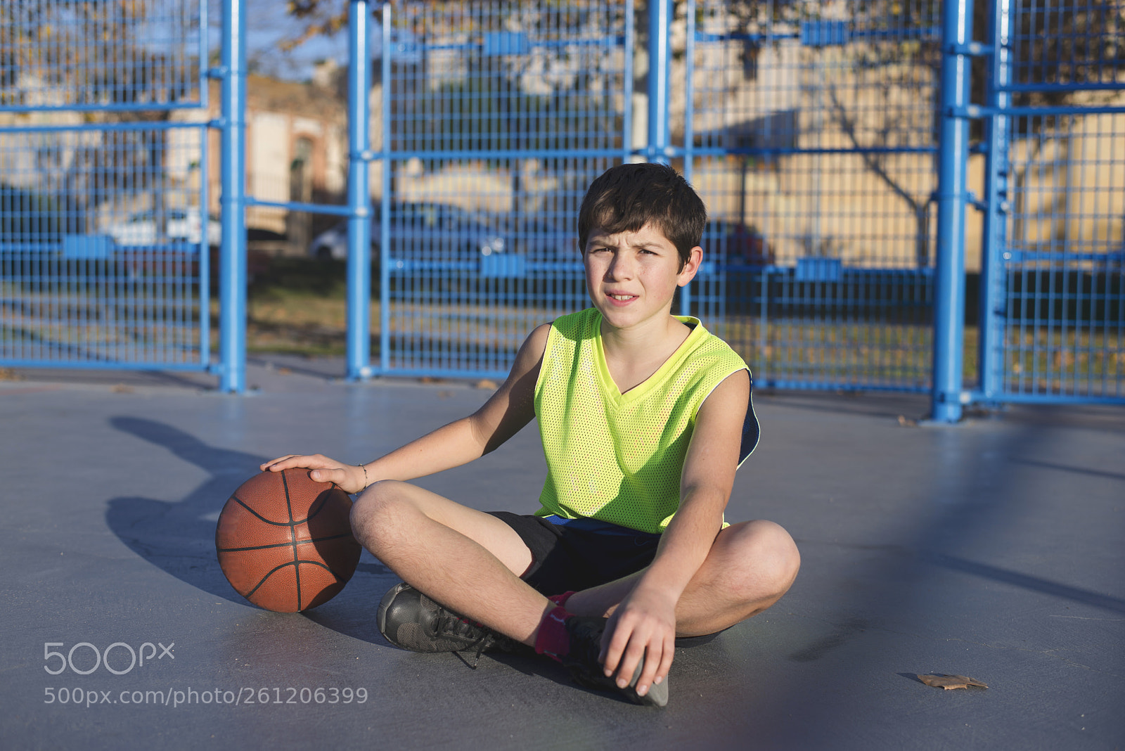 Nikon D610 sample photo. Young basketball player sitting photography