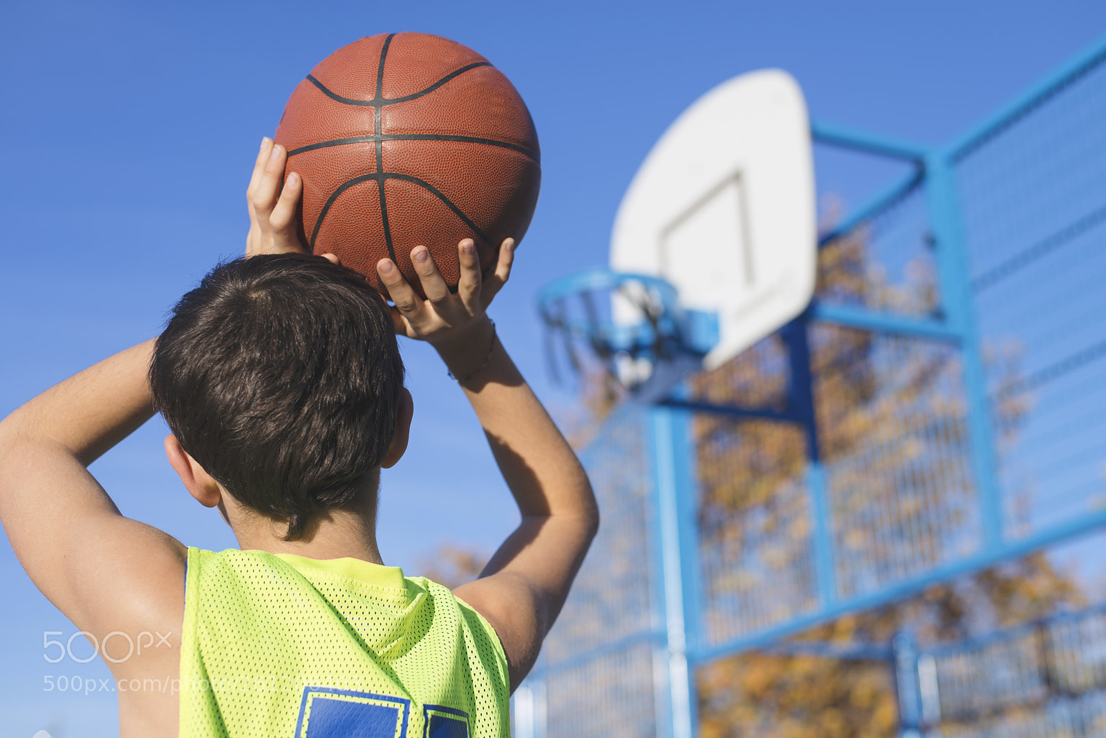 Nikon D610 sample photo. Teenager throwing a basketball photography