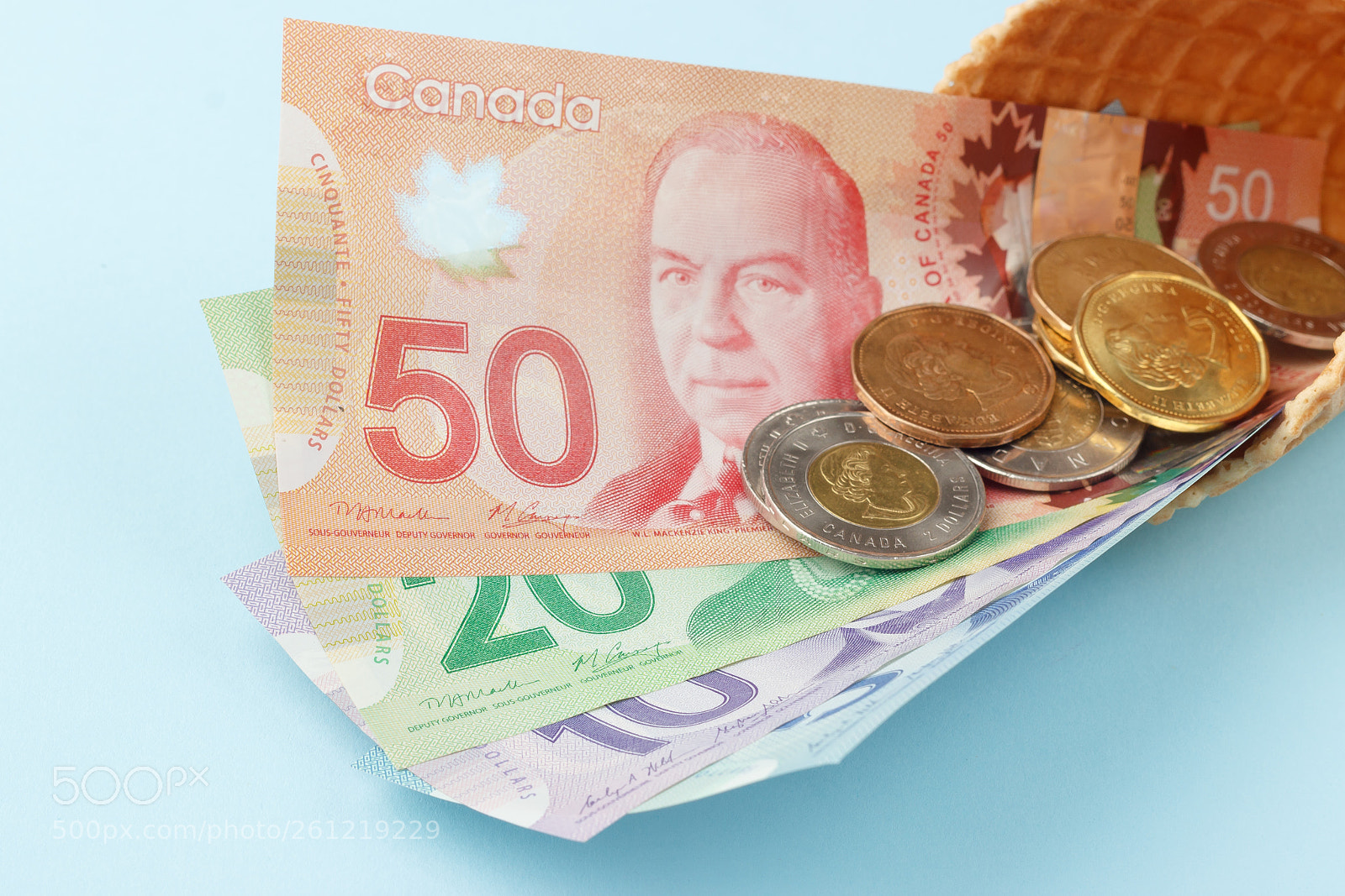Canon EOS 600D (Rebel EOS T3i / EOS Kiss X5) sample photo. Canadian banknotes on blue photography