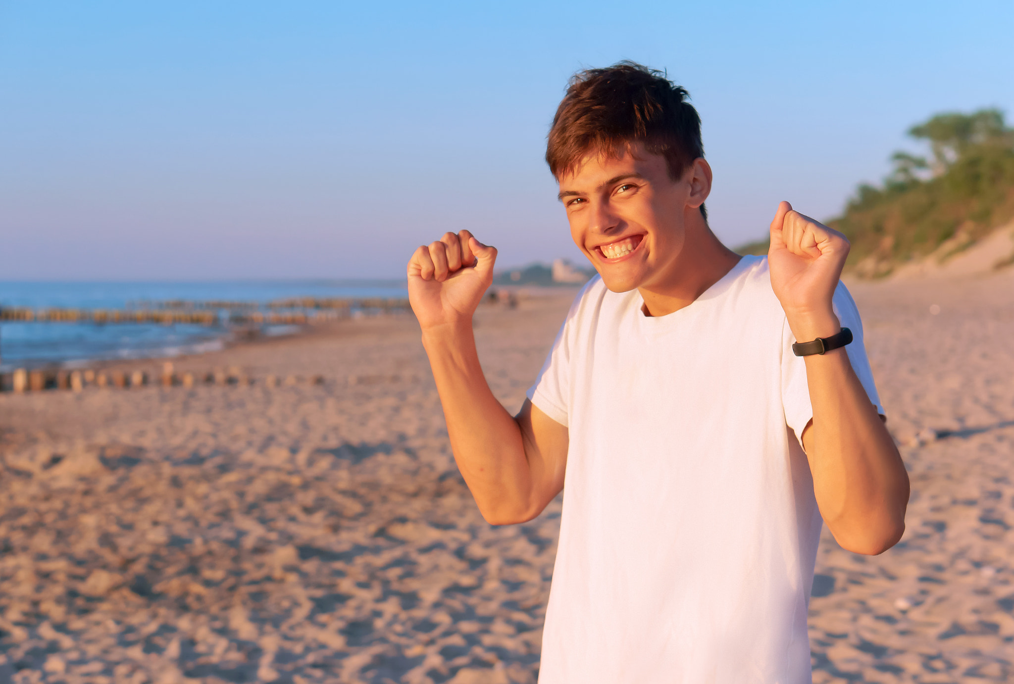 Sony Alpha NEX-3N sample photo. A nice young man is happy on the beach, a young man admires on the beach, the boy is very happy... photography